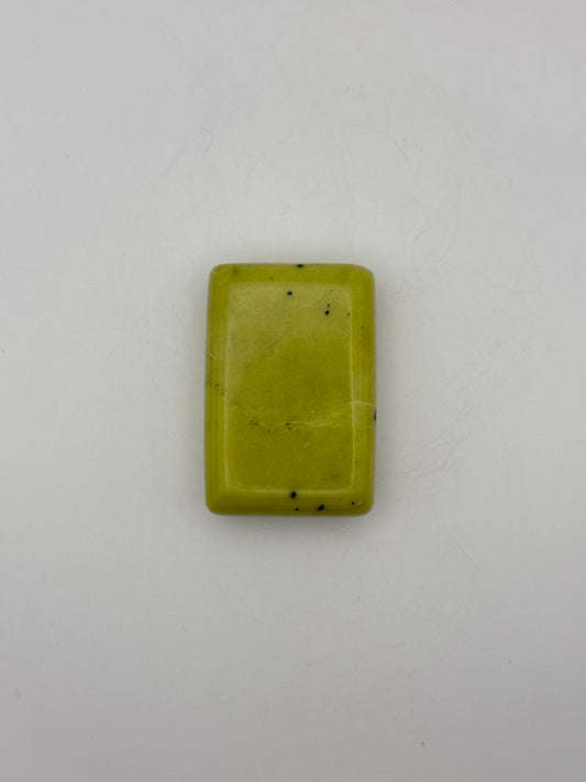 Polished healerite in the shape of a rectangular soap.