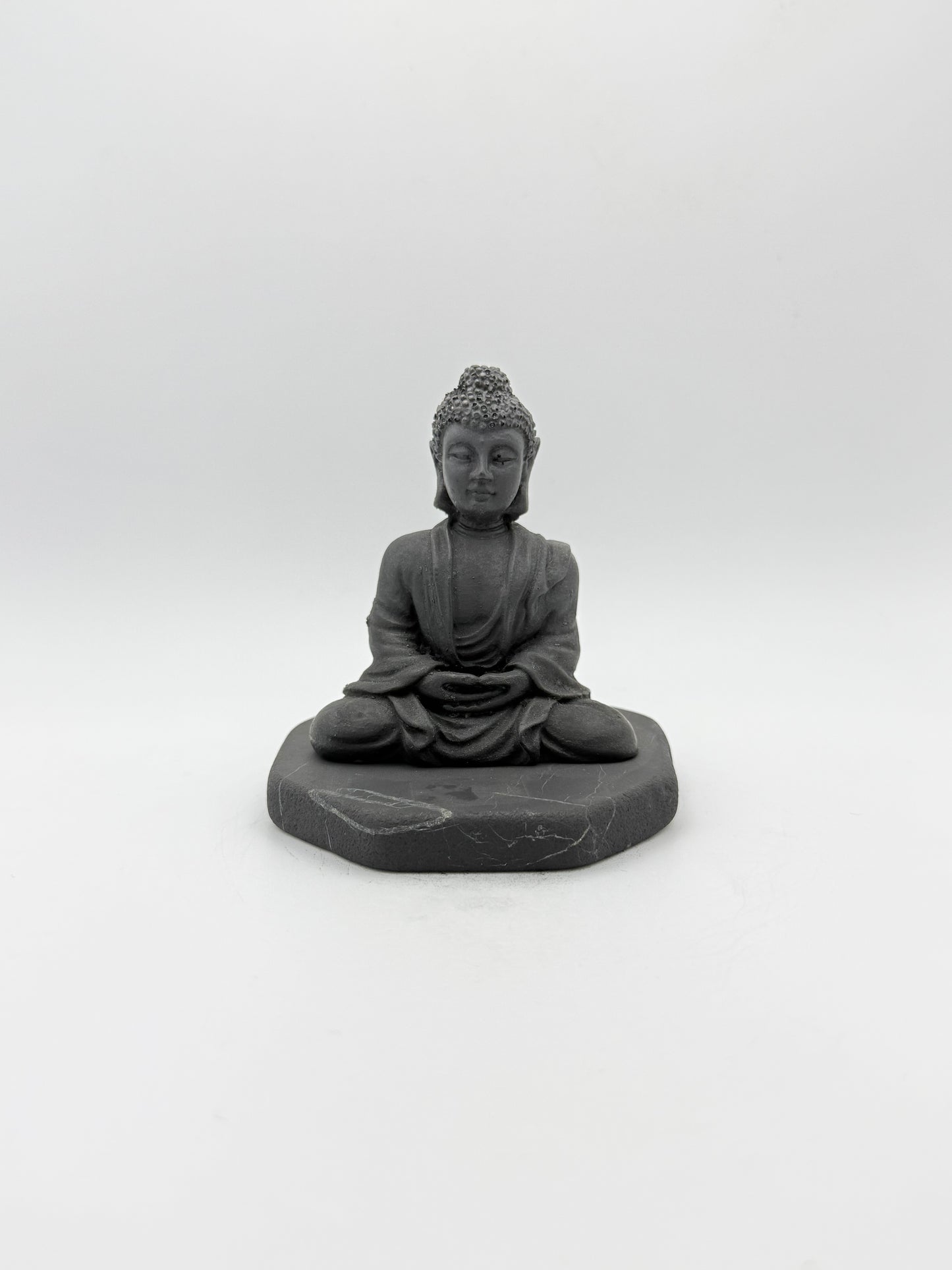 Shungite carving of a buddha.