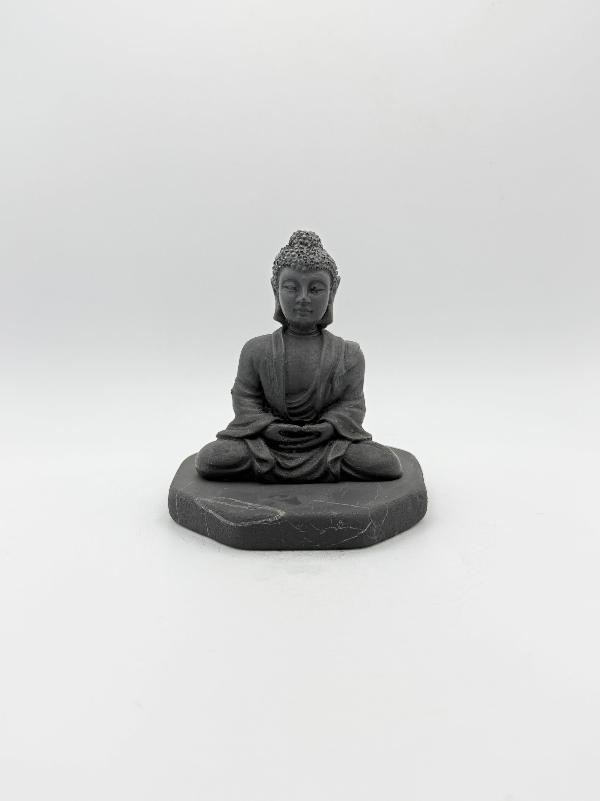 Shungite carving of a buddha.