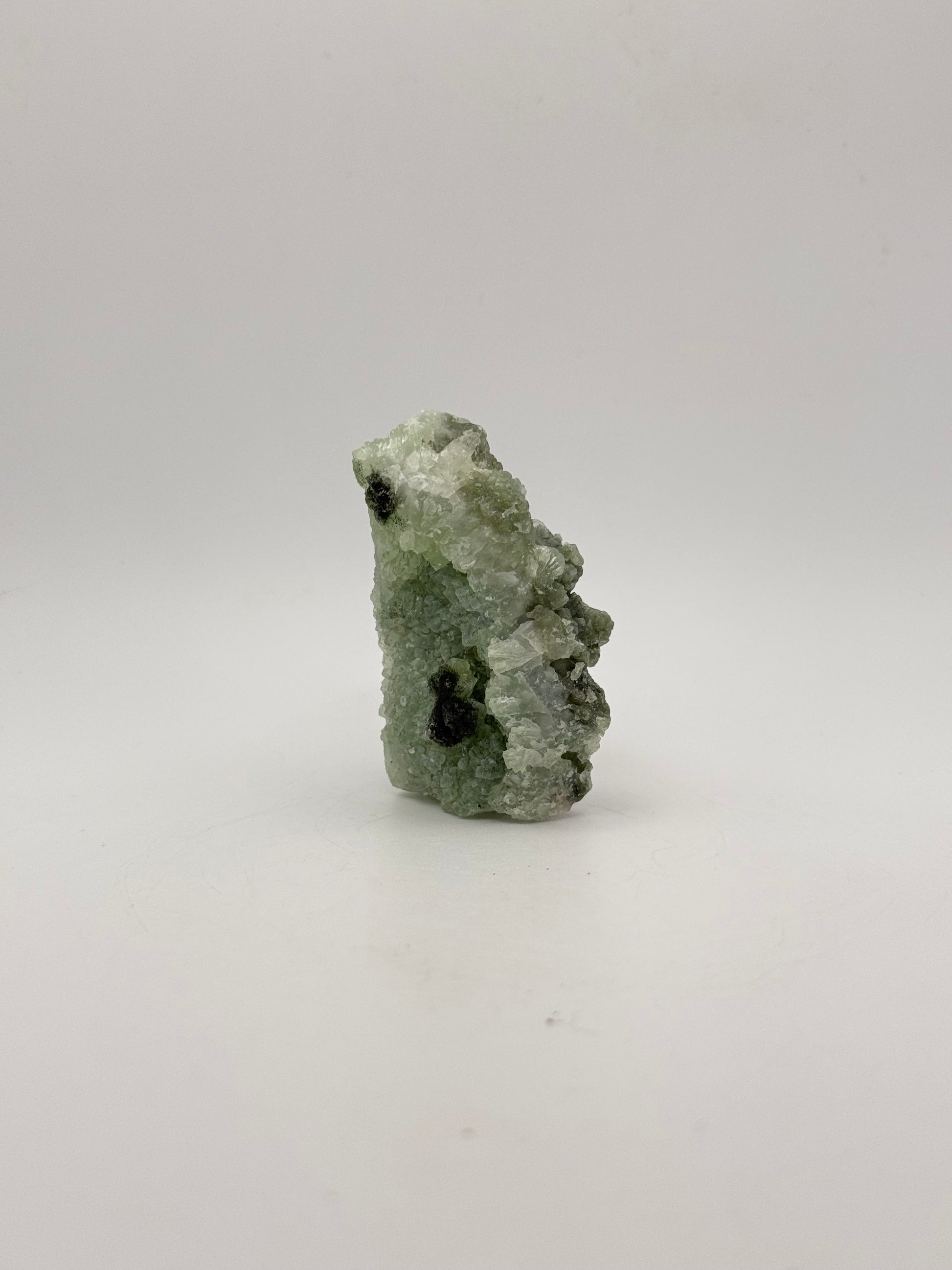 Raw Prehnite specimen with amazing green color.