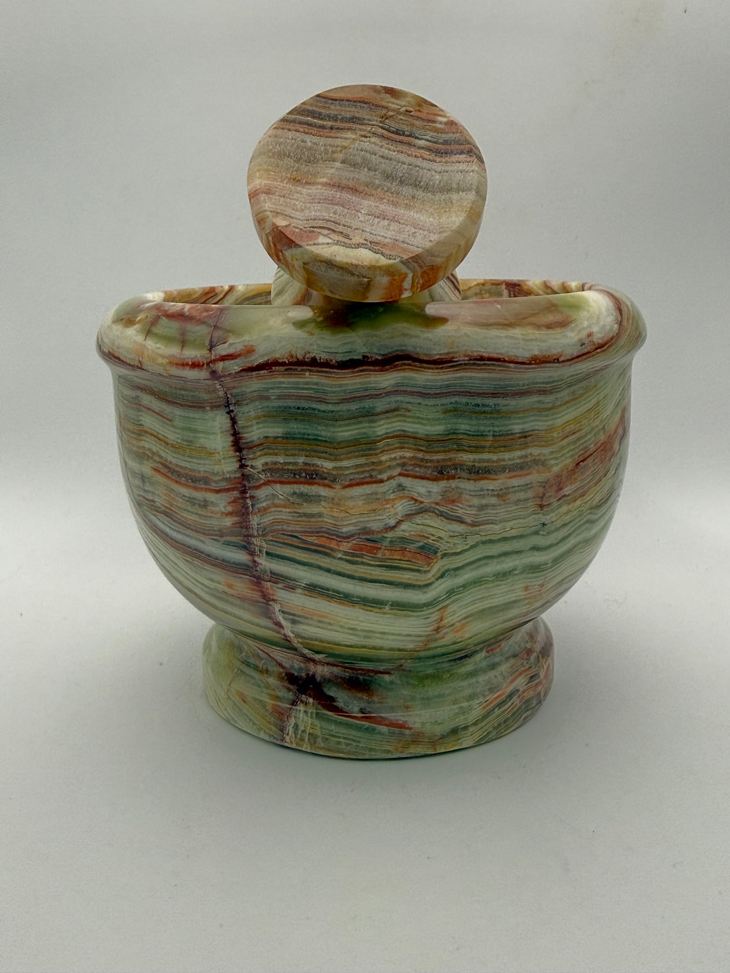 Mortar and pestle made out of onyx stone.