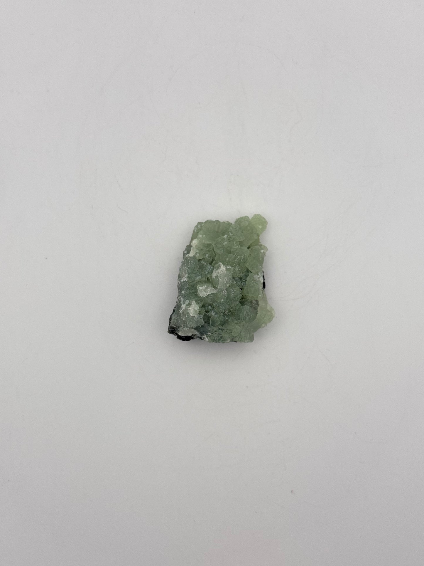 Raw Prehnite specimen with amazing green color.