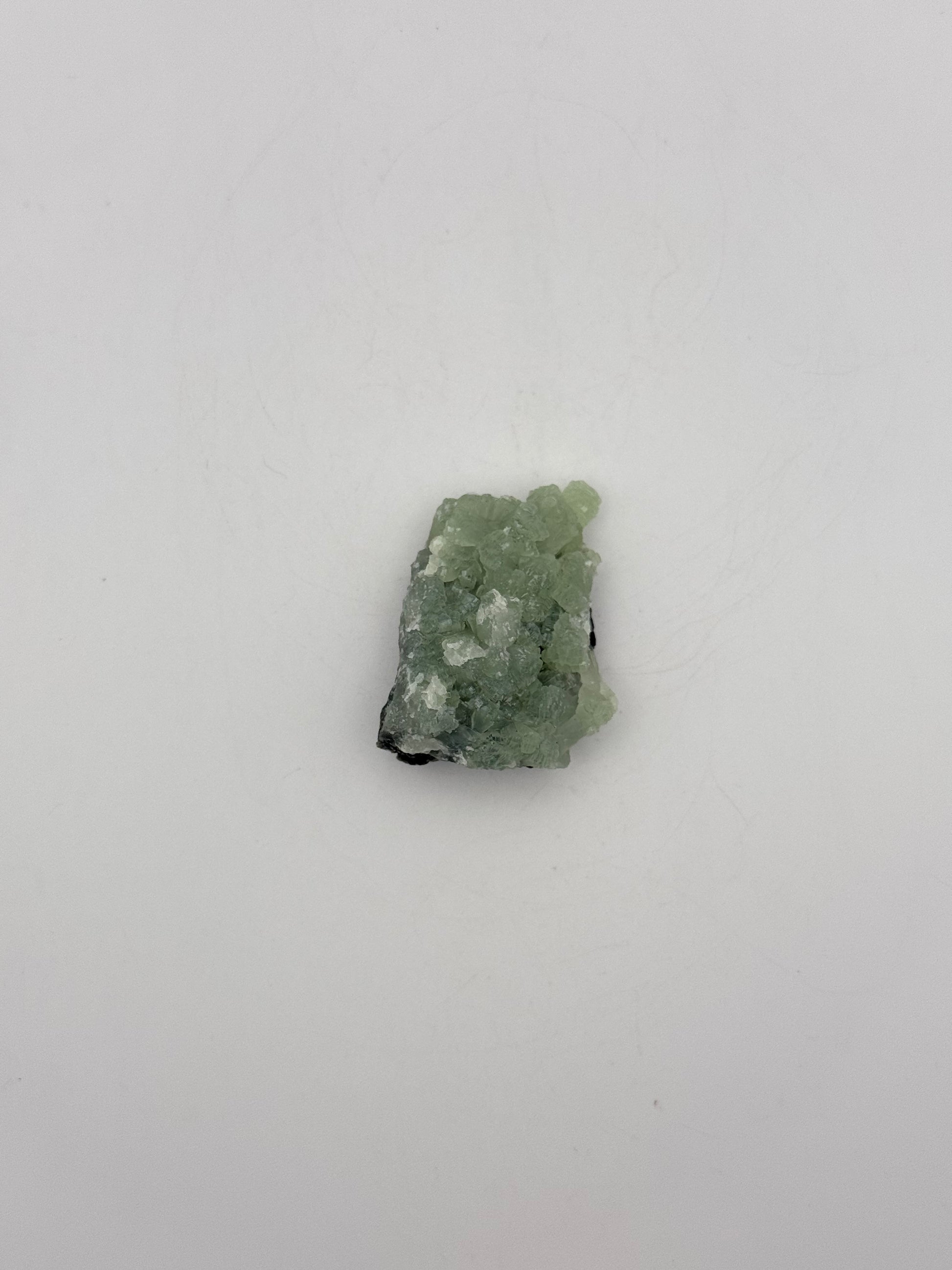 Raw Prehnite specimen with amazing green color.