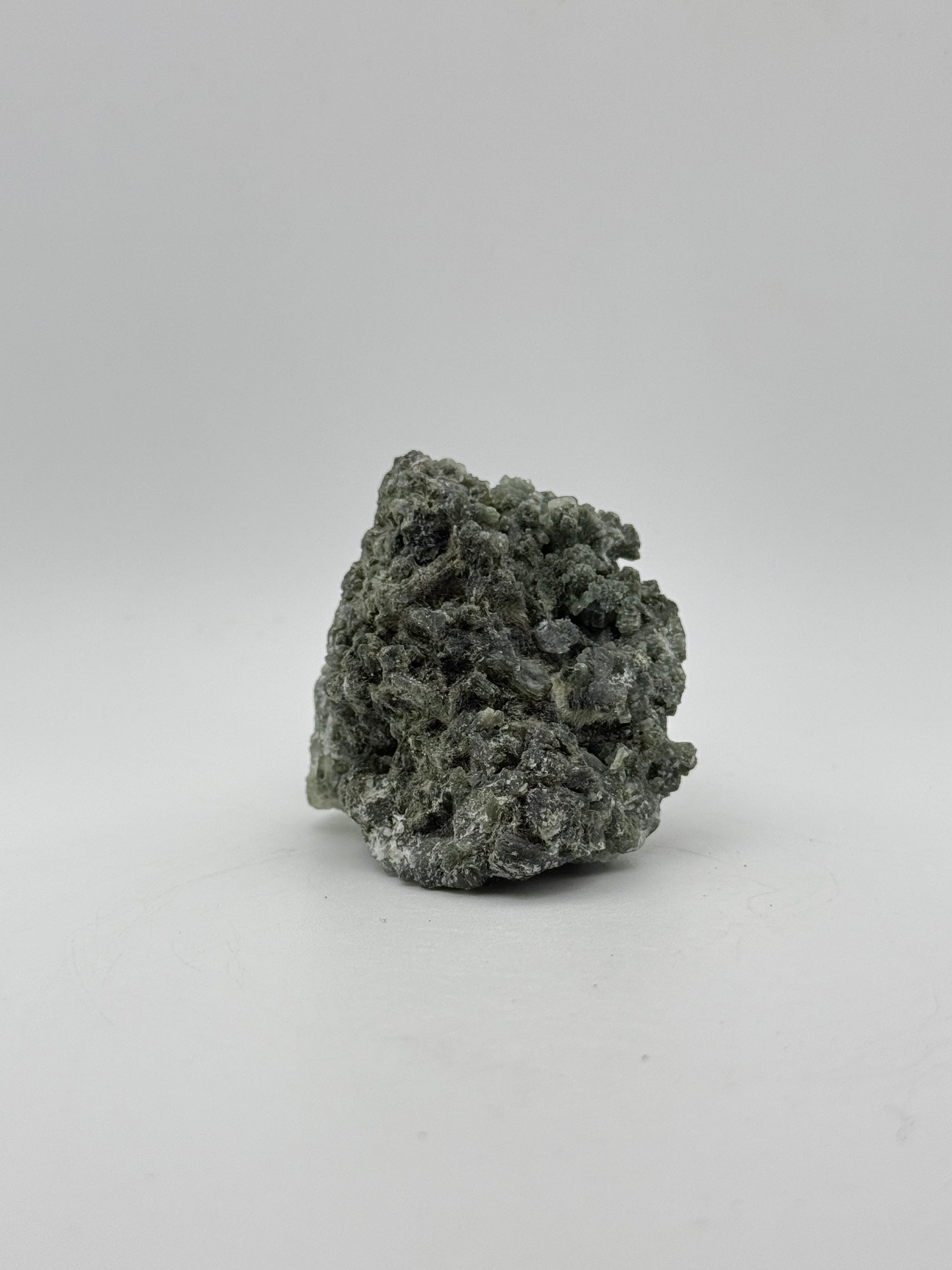 Raw prehnite specimen with amazing green color.