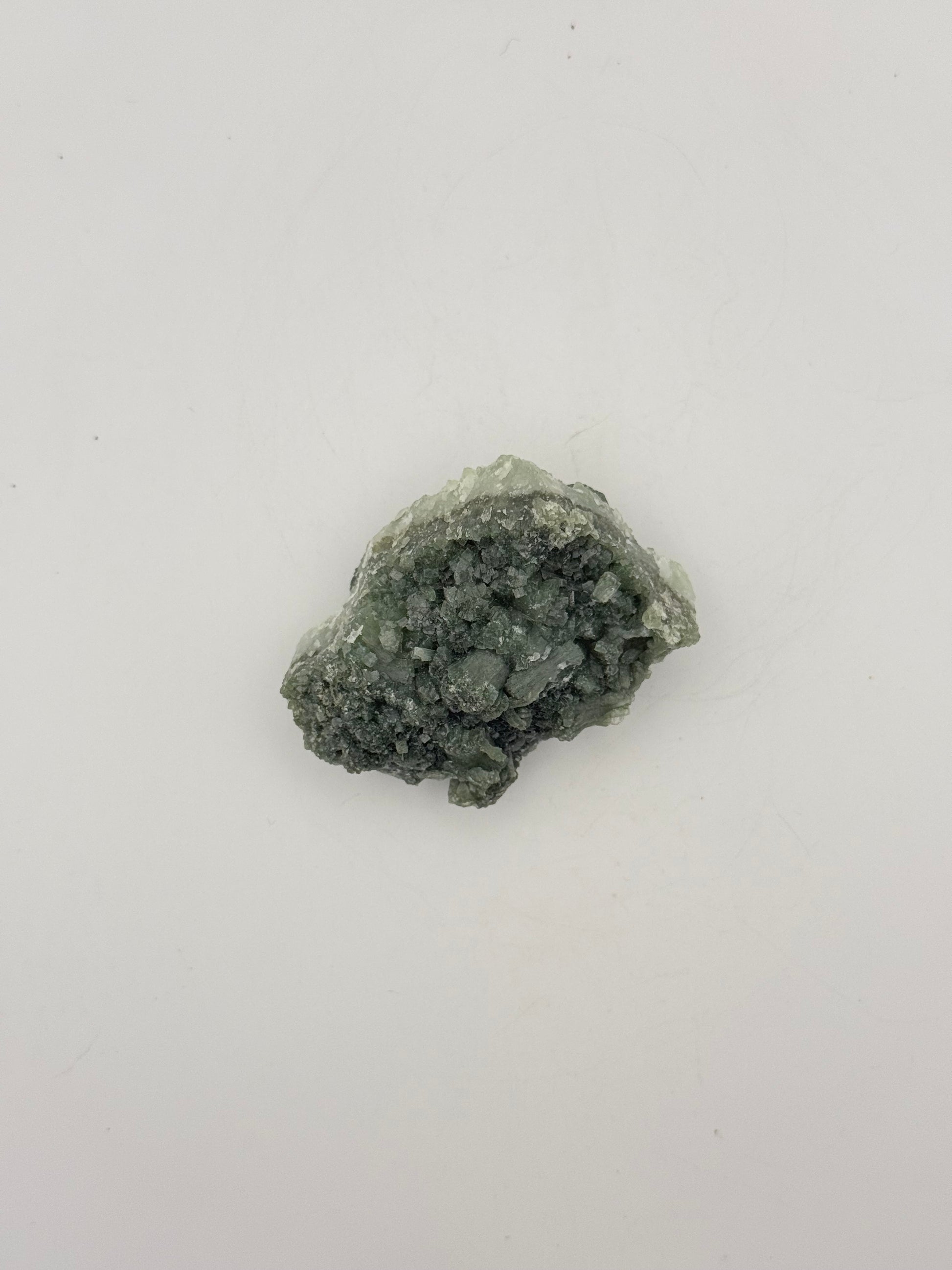 Raw Prehnite specimen with amazing green color.