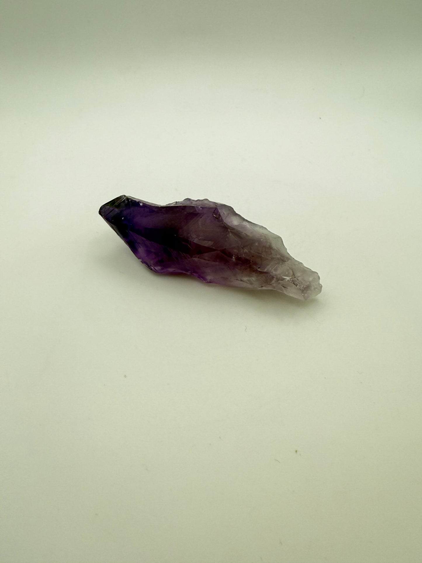 Amethyst crystal with deep purple color.