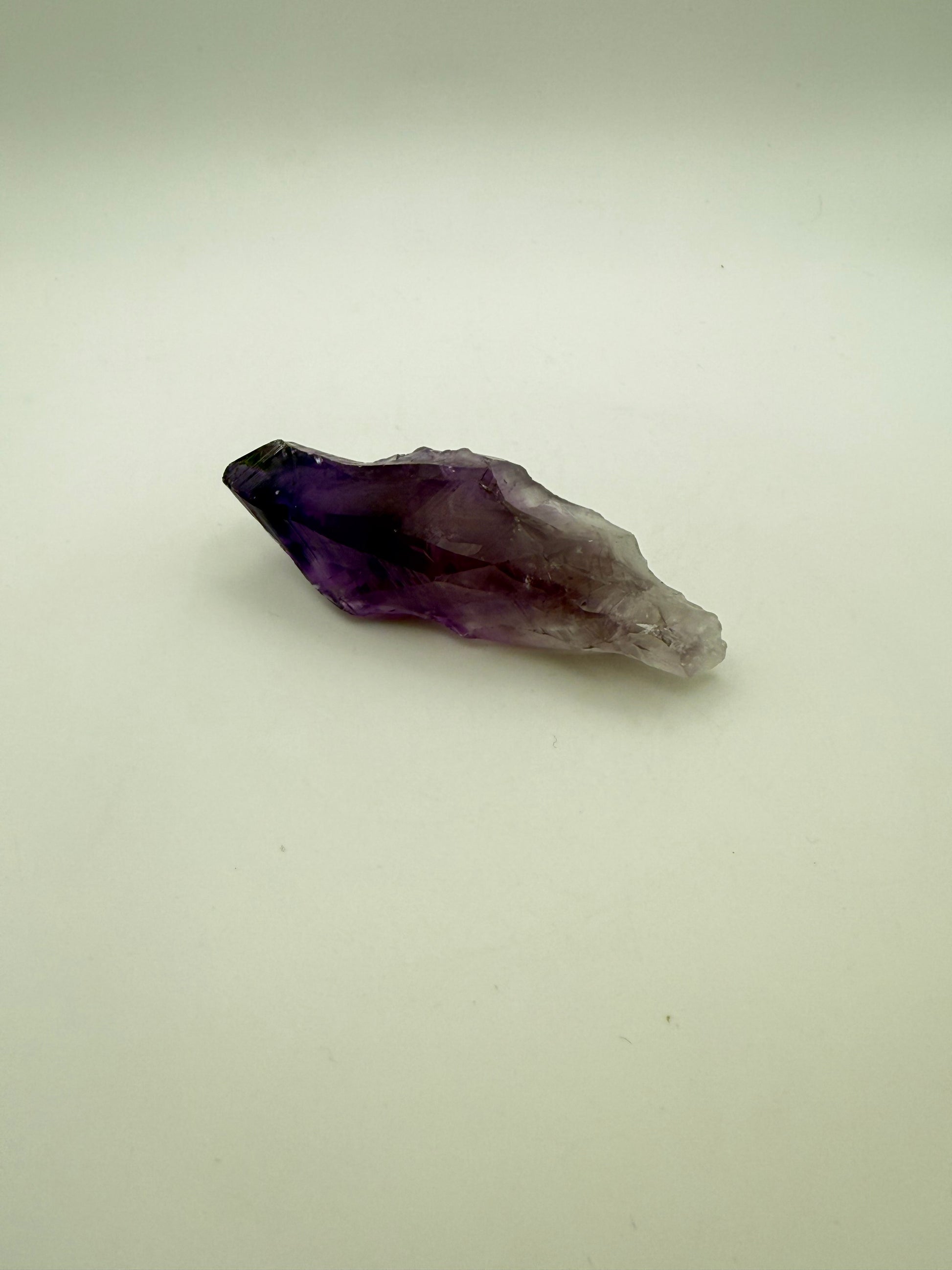 Amethyst crystal with deep purple color.