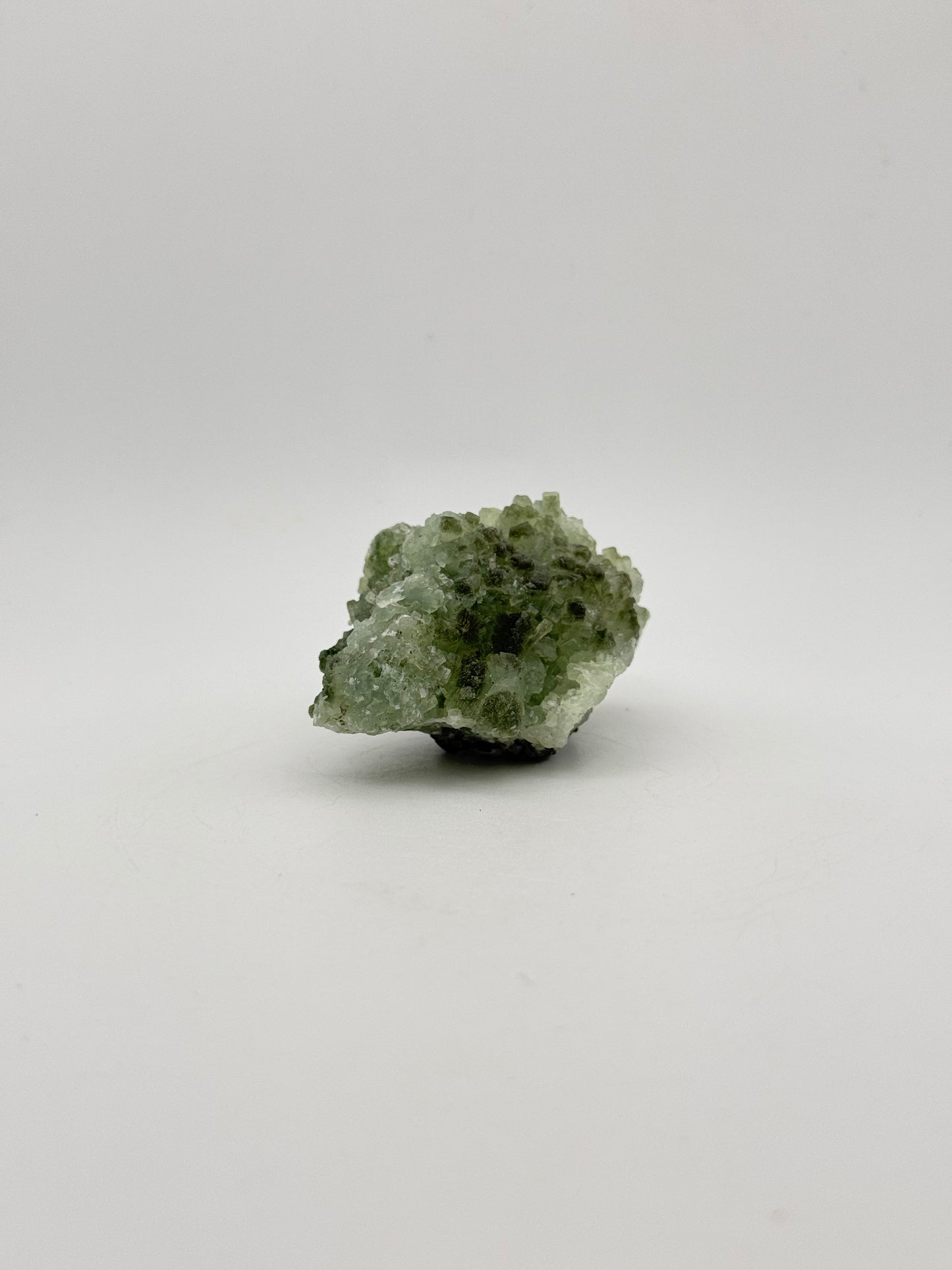 Raw Prehnite specimen with amazing green color.