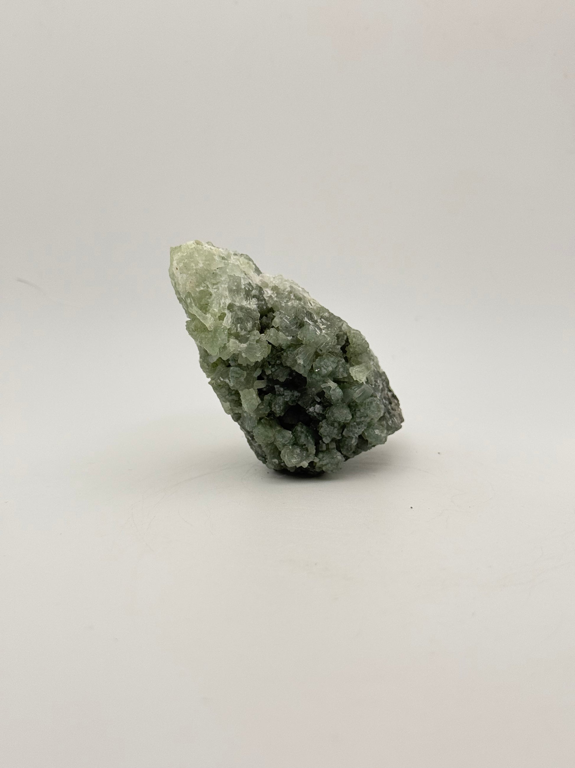 Raw Prehnite specimen with amazing green color.