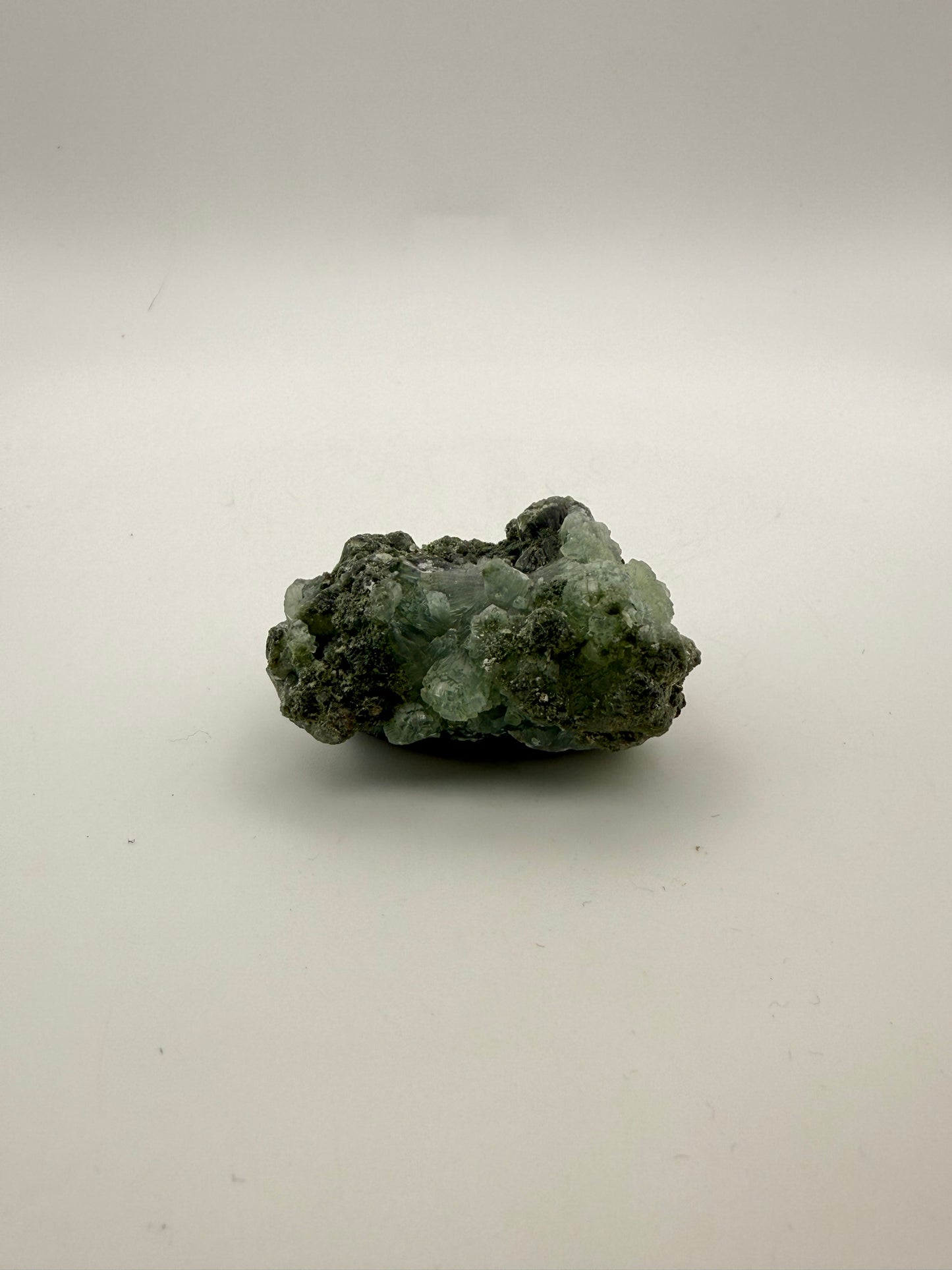 Raw Prehnite specimen with amazing green color.