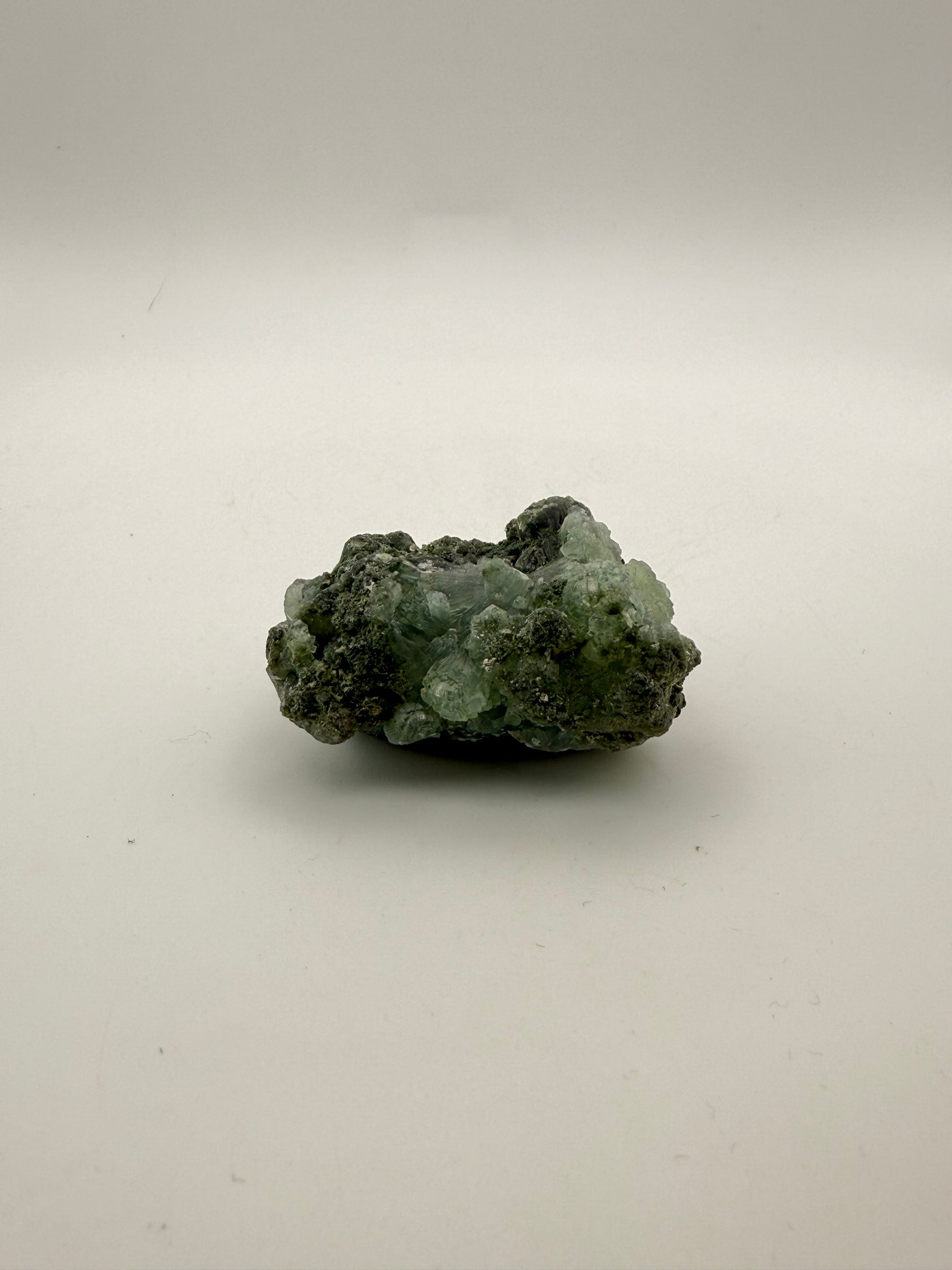 Raw Prehnite specimen with amazing green color.