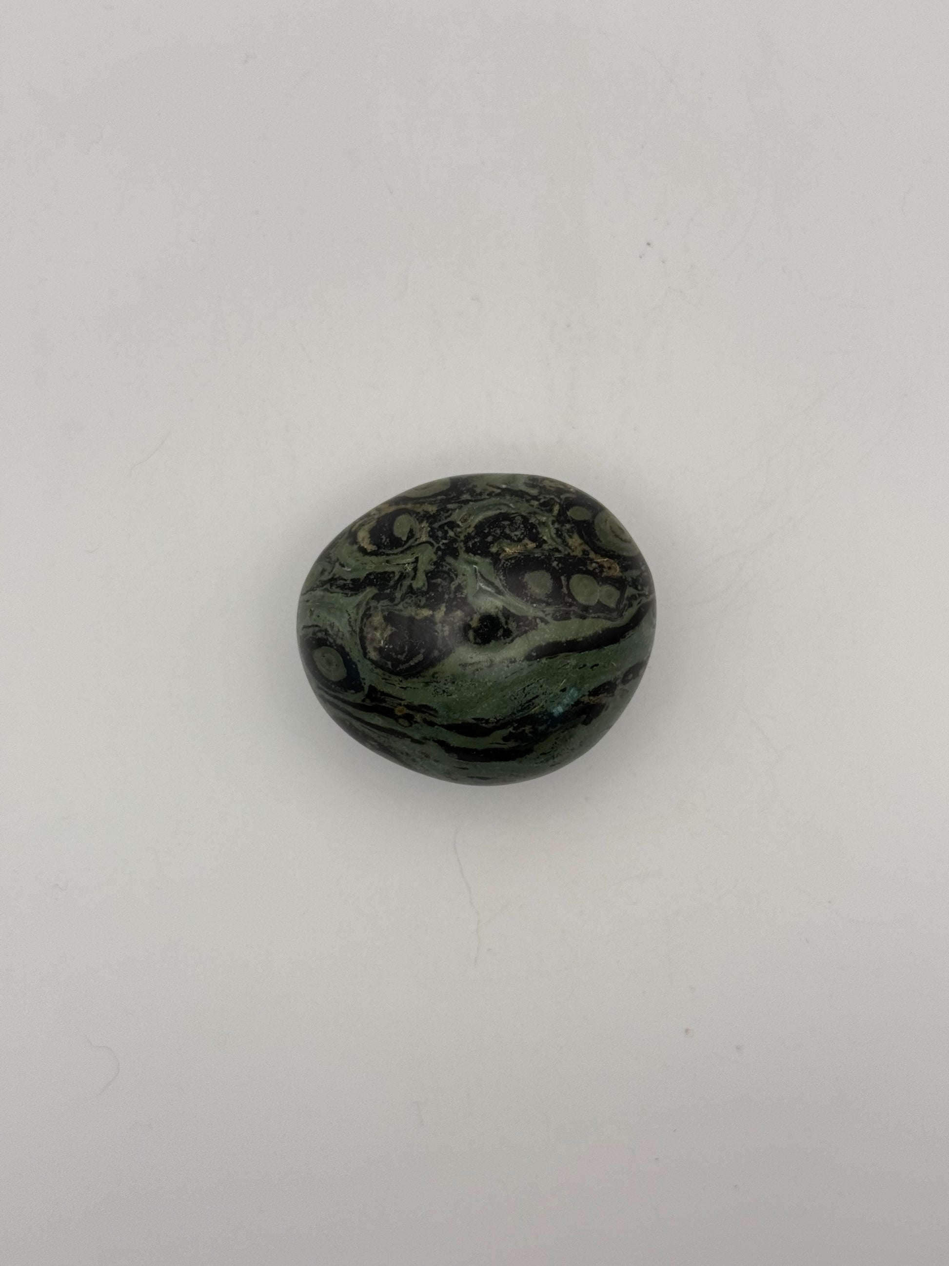 Polished kambaba jasper palm stone.