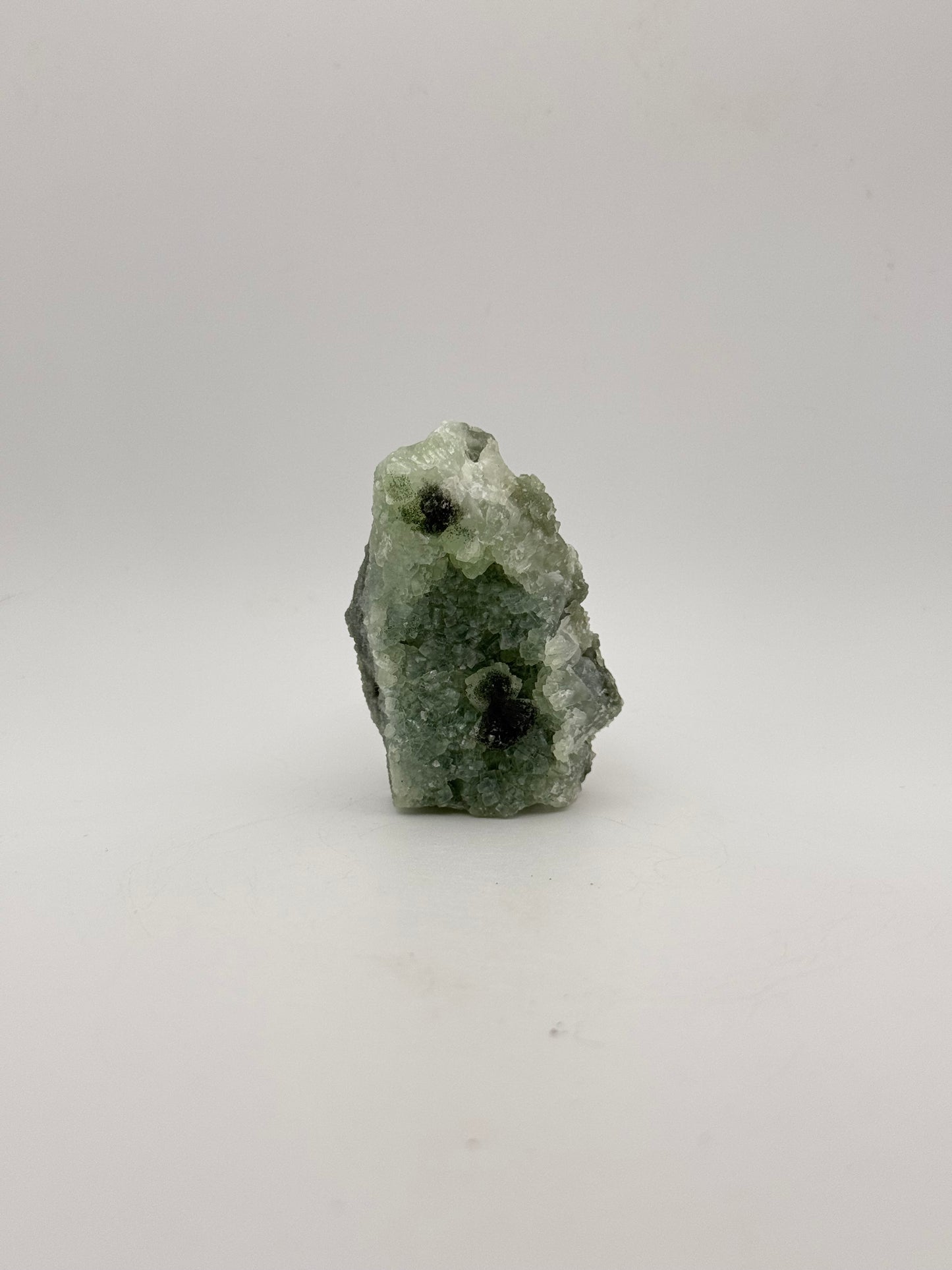 Raw Prehnite specimen with amazing green color.