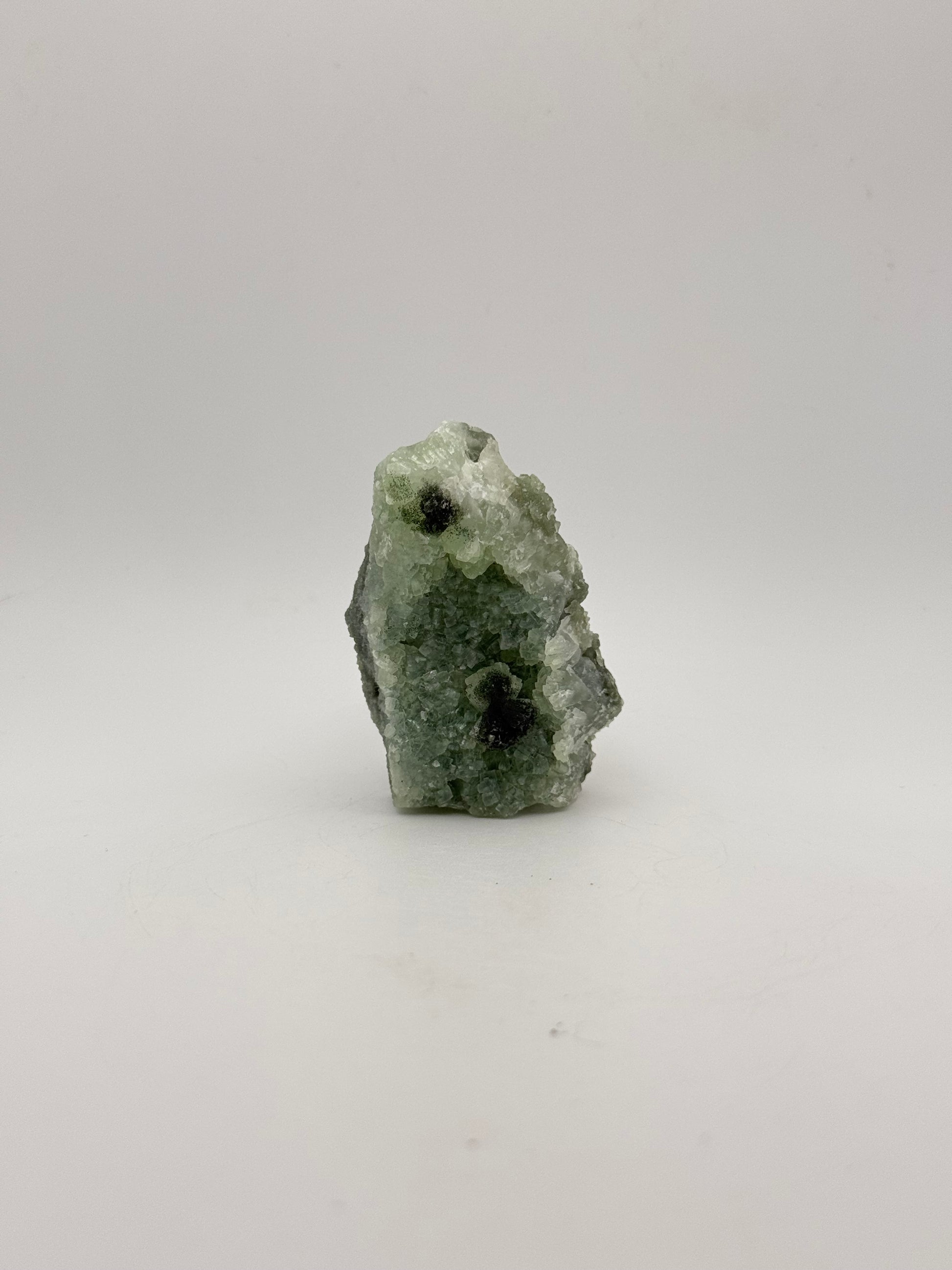 Raw Prehnite specimen with amazing green color.