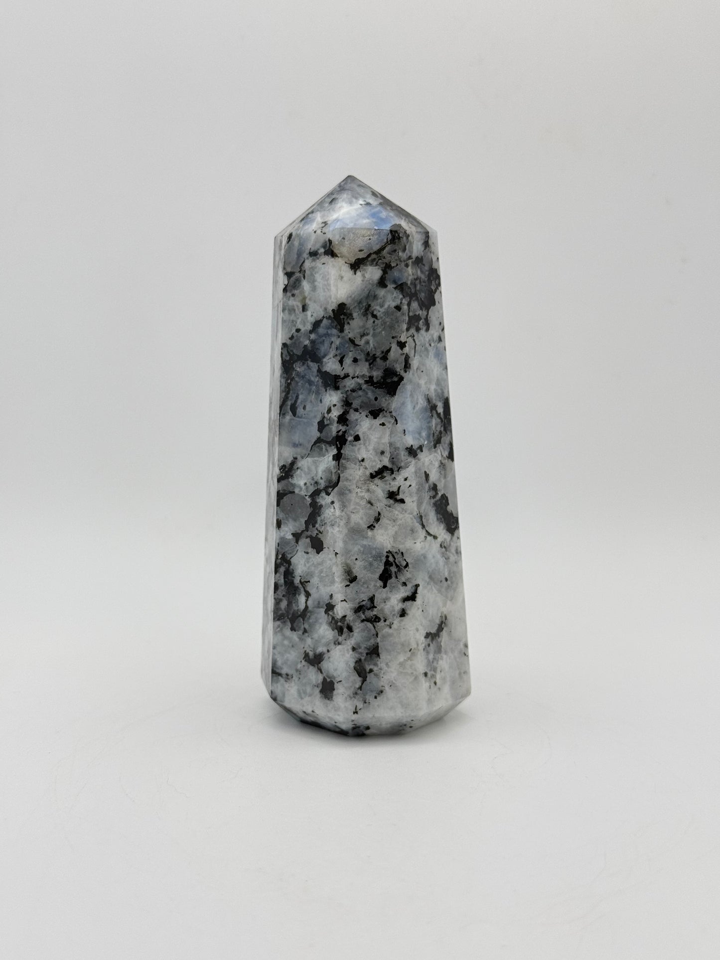 Polished rainbow moonstone tower with nice flashes of blue.