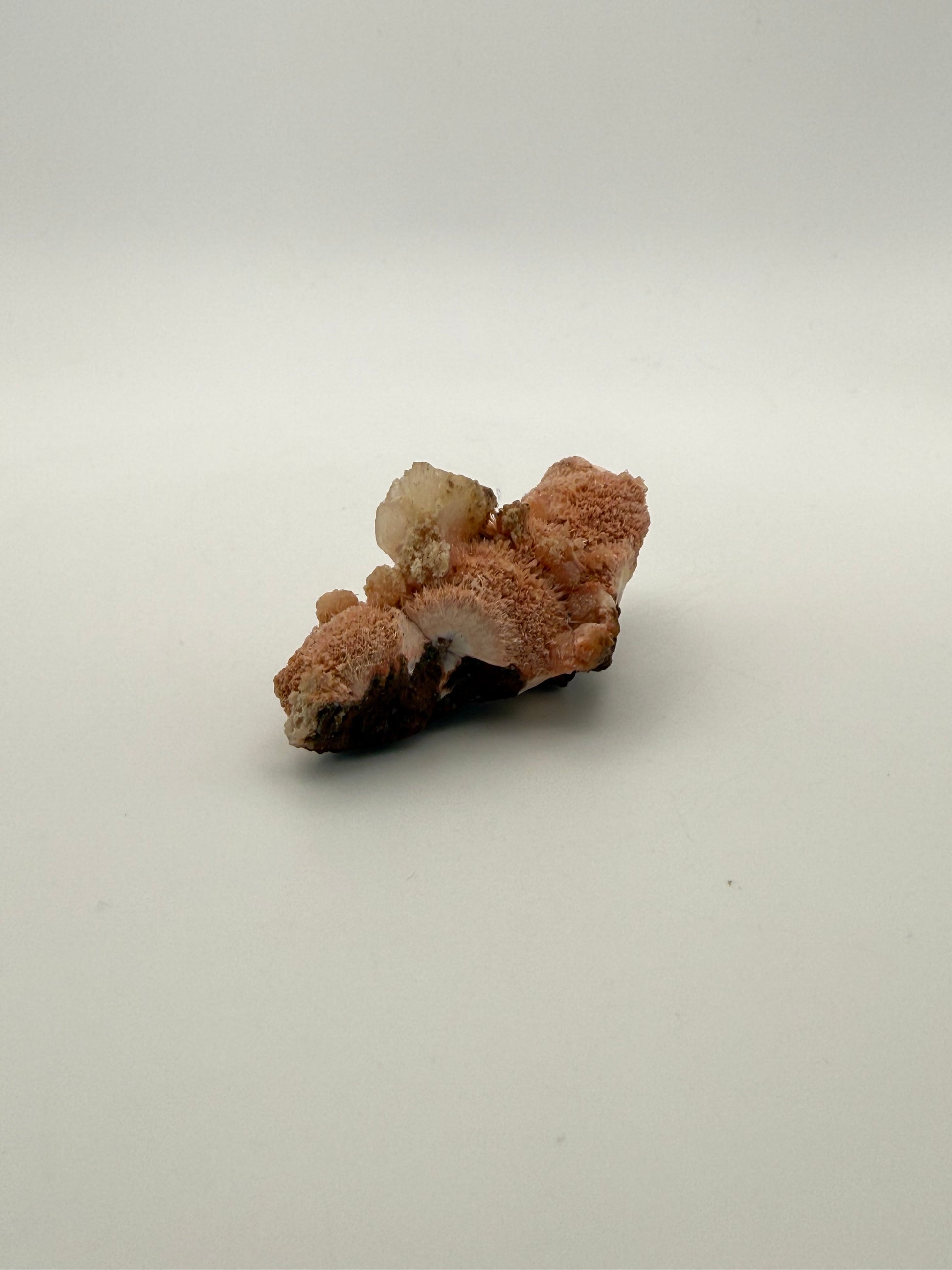 Raw Messolite crystal.