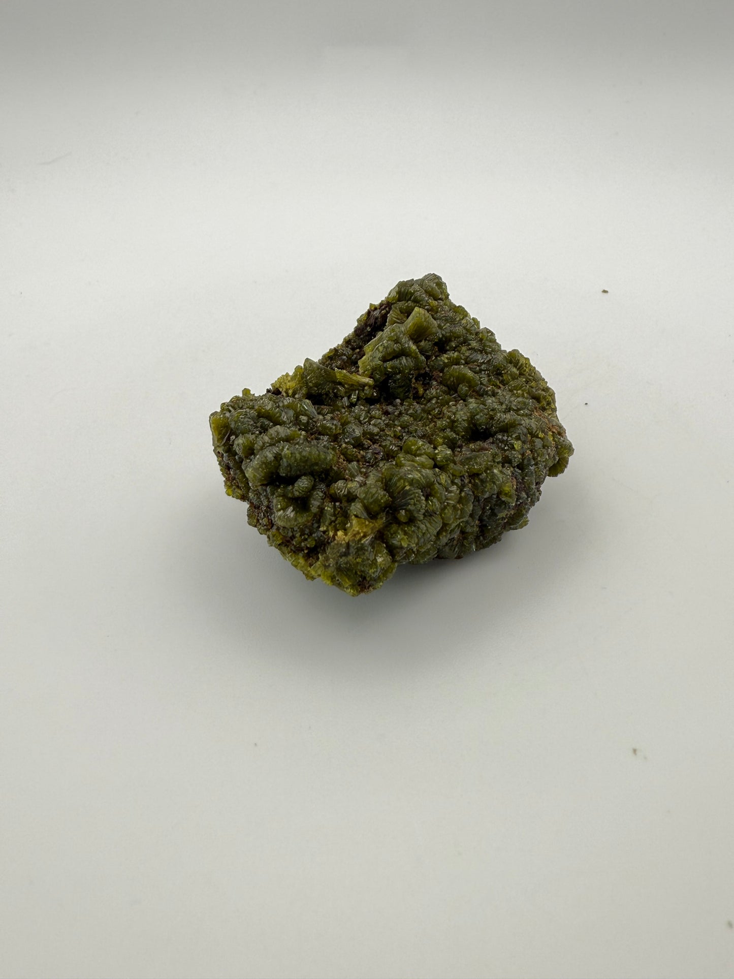 Epidote crystal cluster with good green color.