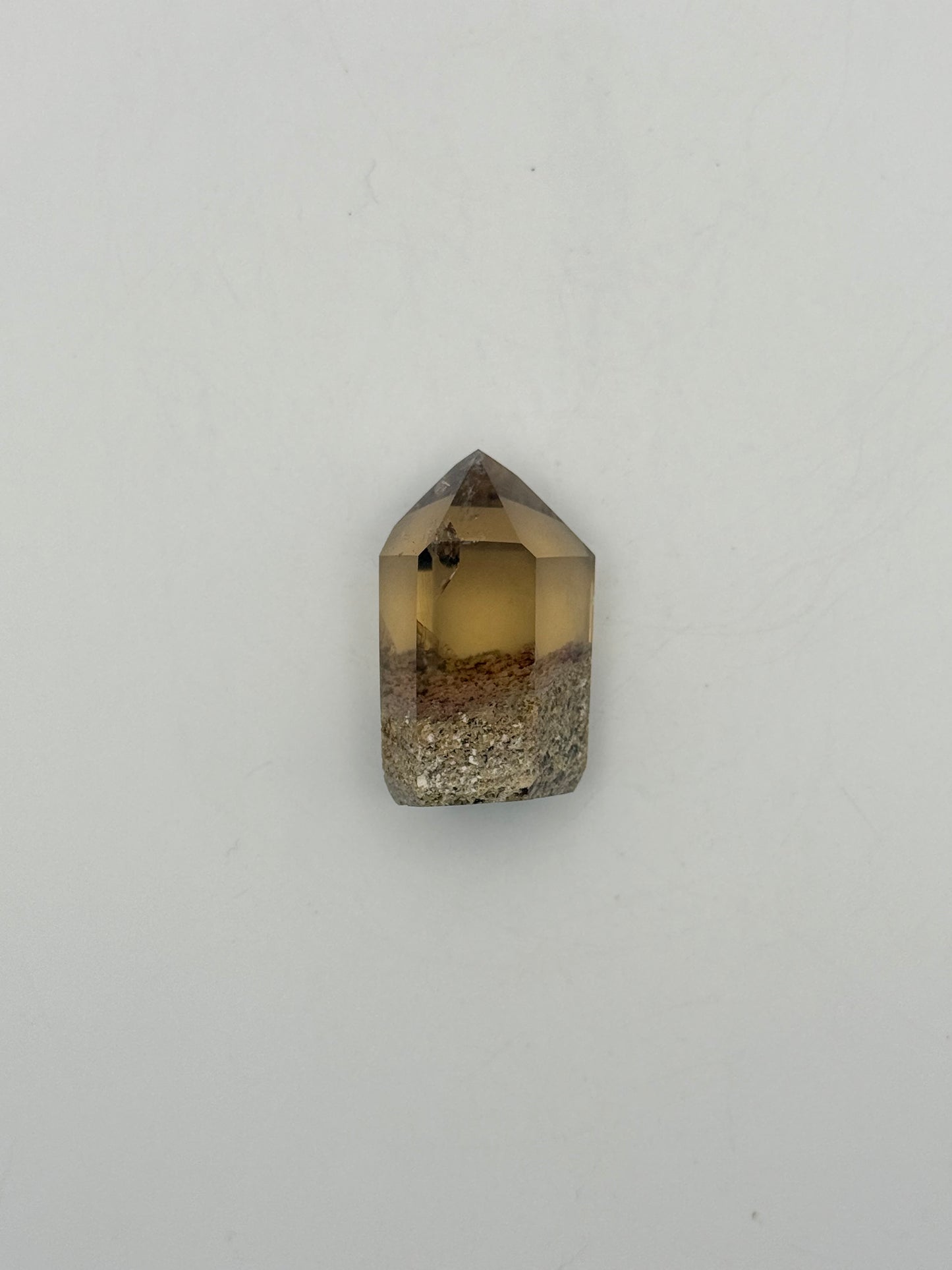 Polished natural citrine point.