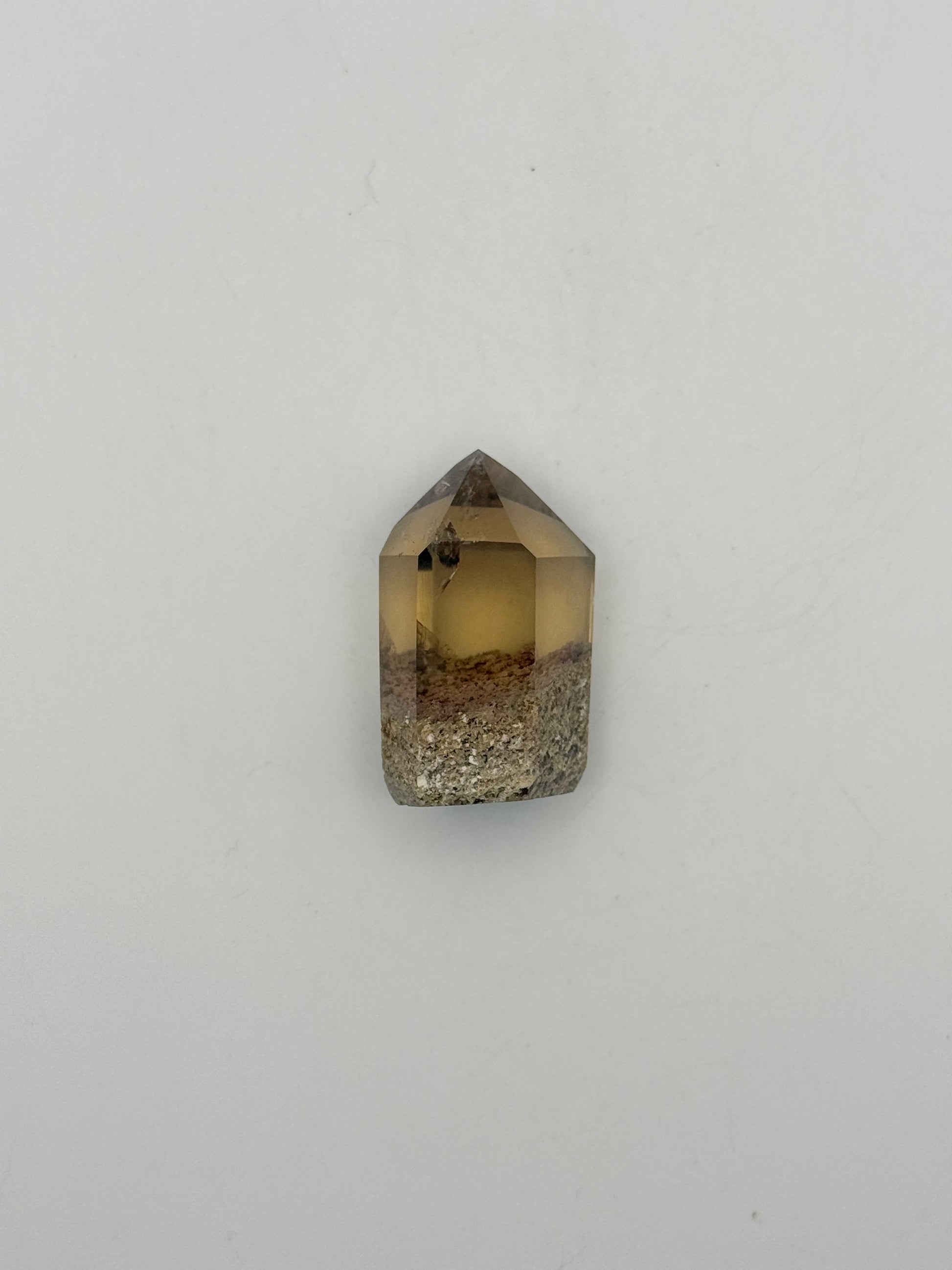 Polished natural citrine point.