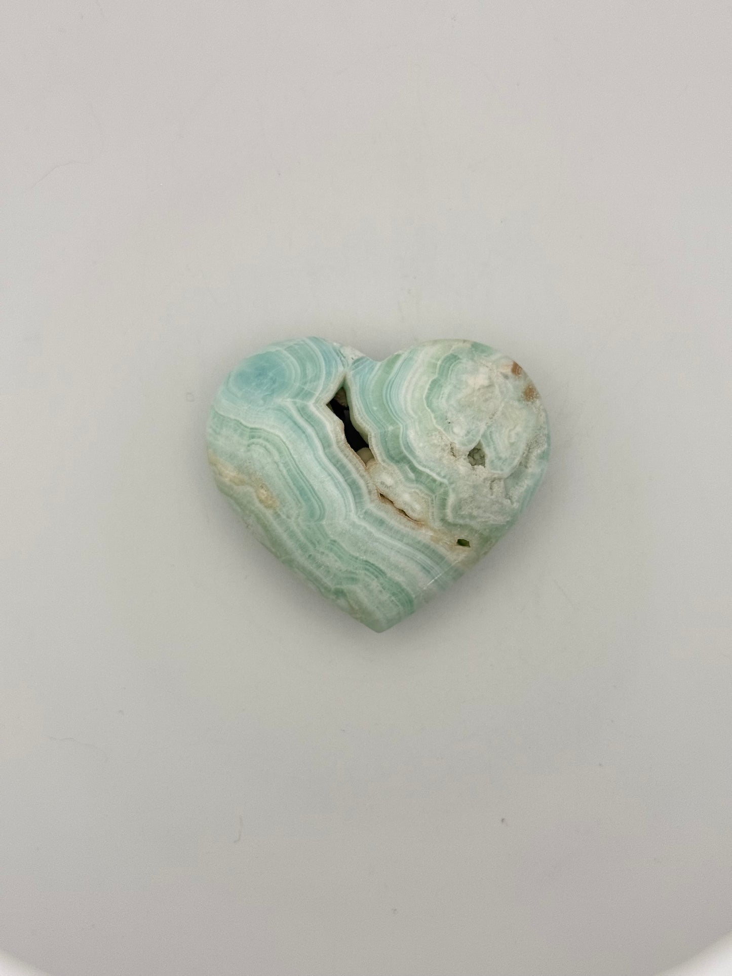 Caribbean Calcite polished crystal in the shape of a heart.