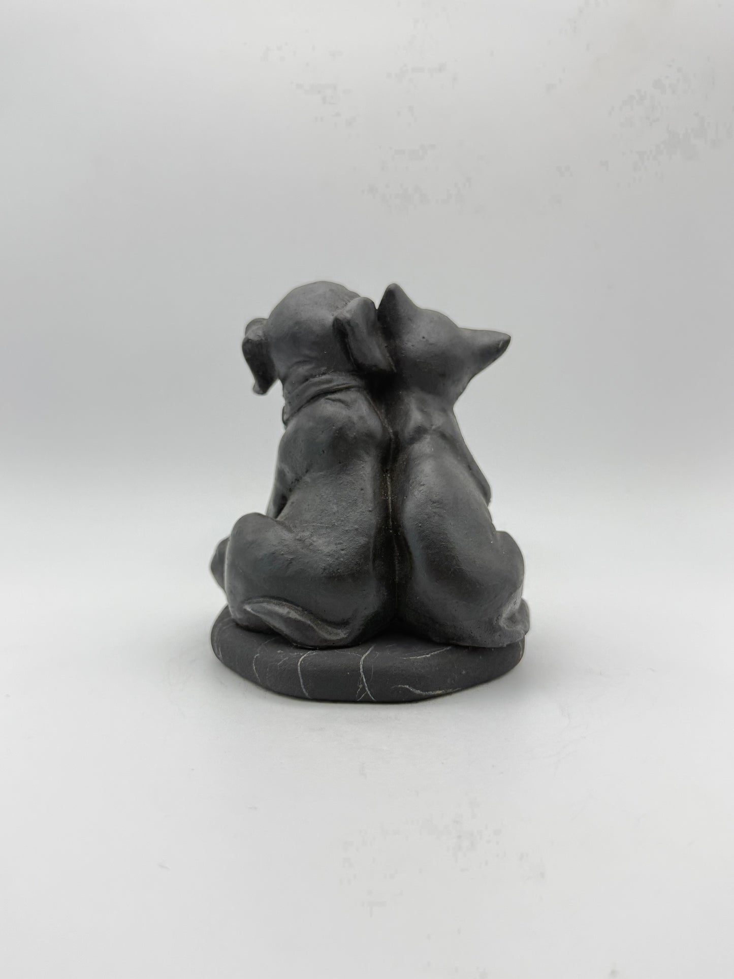 Shungite carving of a cat and dog.