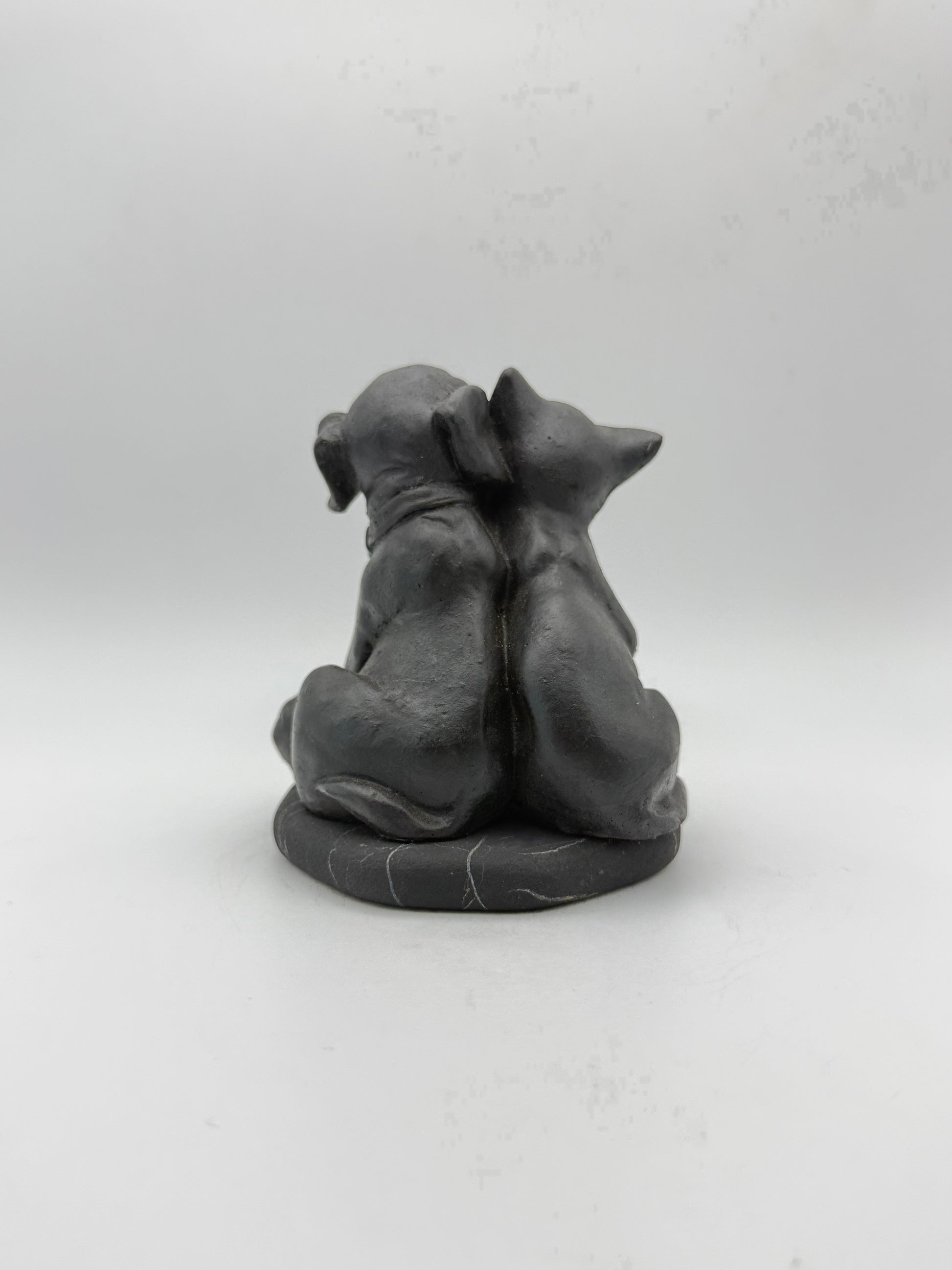 Shungite carving of a cat and dog.