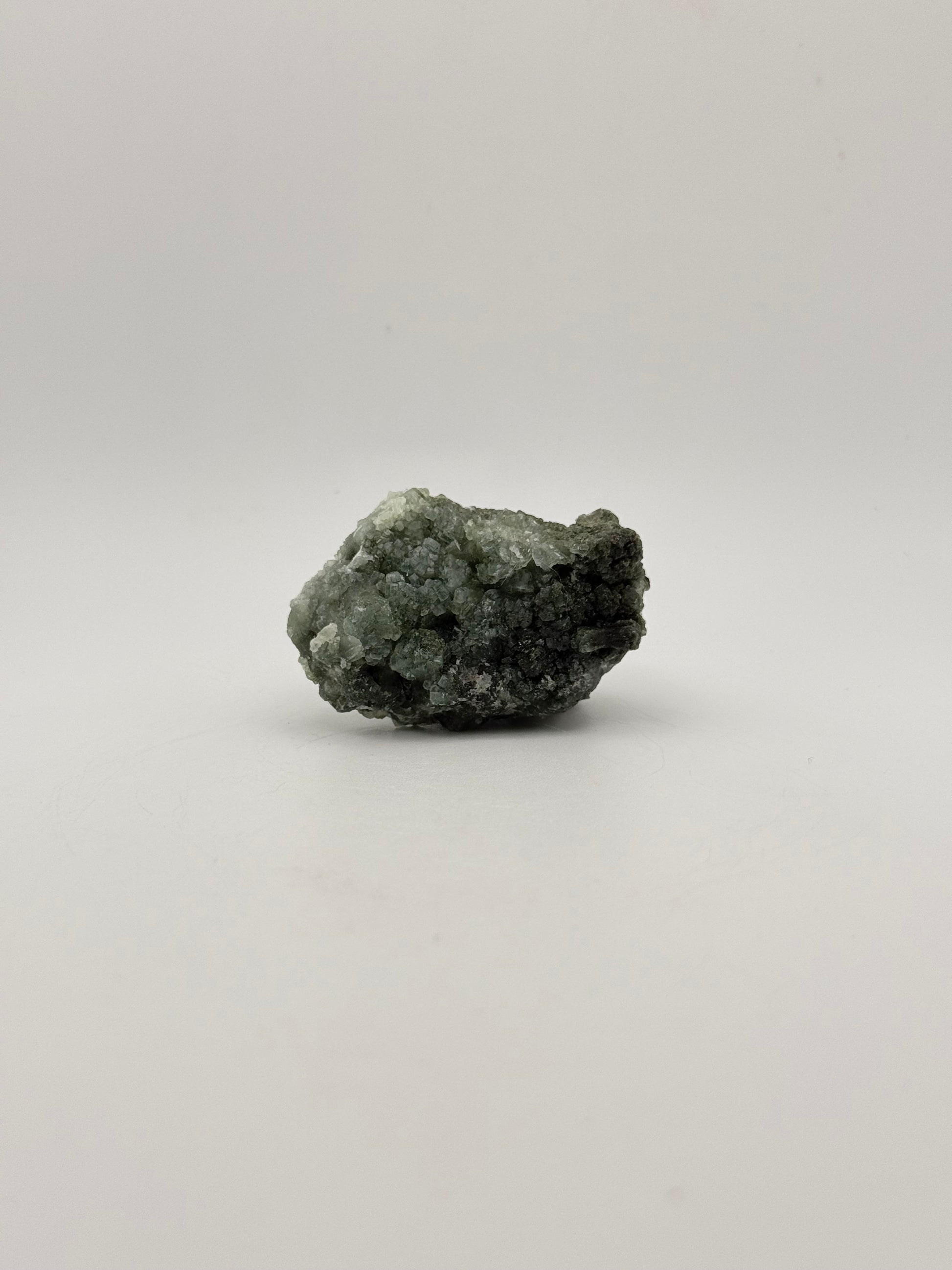 Raw Prehnite specimen with amazing green color.