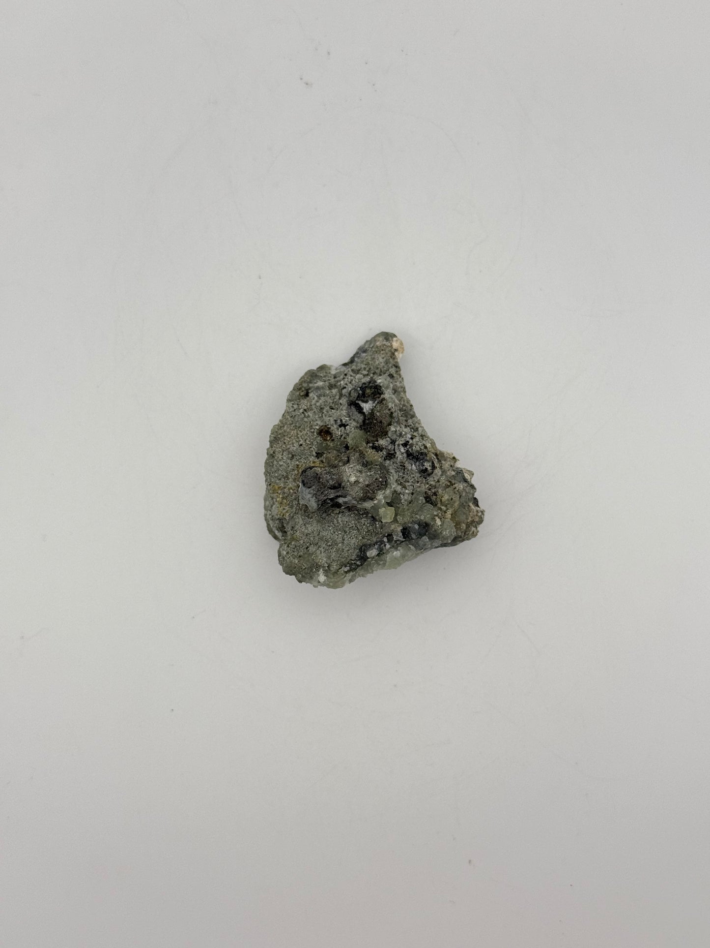 Raw prehnite specimen with amazing green color.