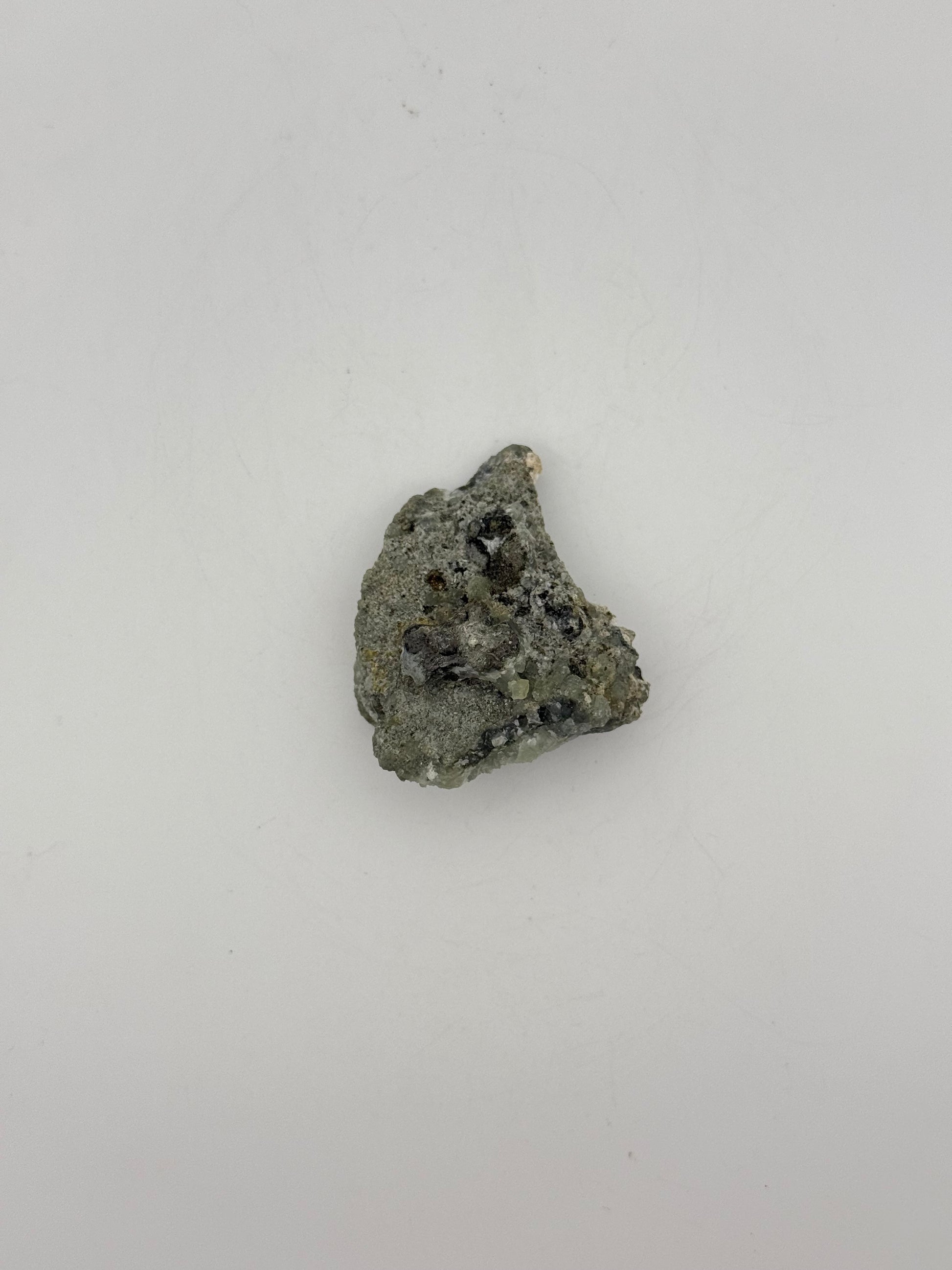 Raw prehnite specimen with amazing green color.