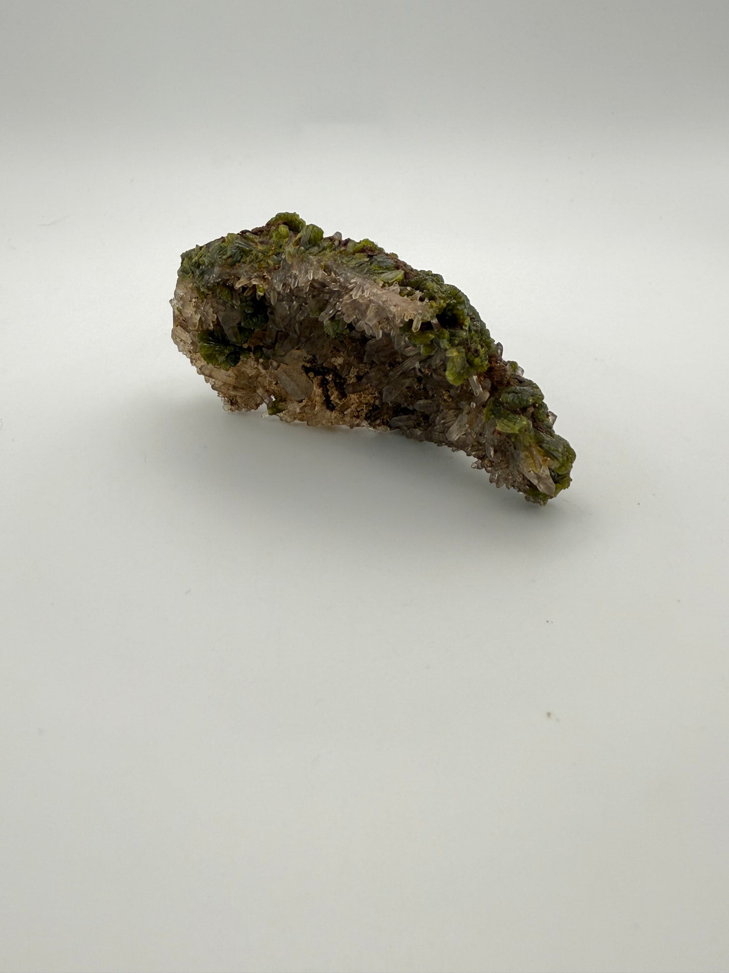Epidote crystal cluster with good green color as well as quartz.