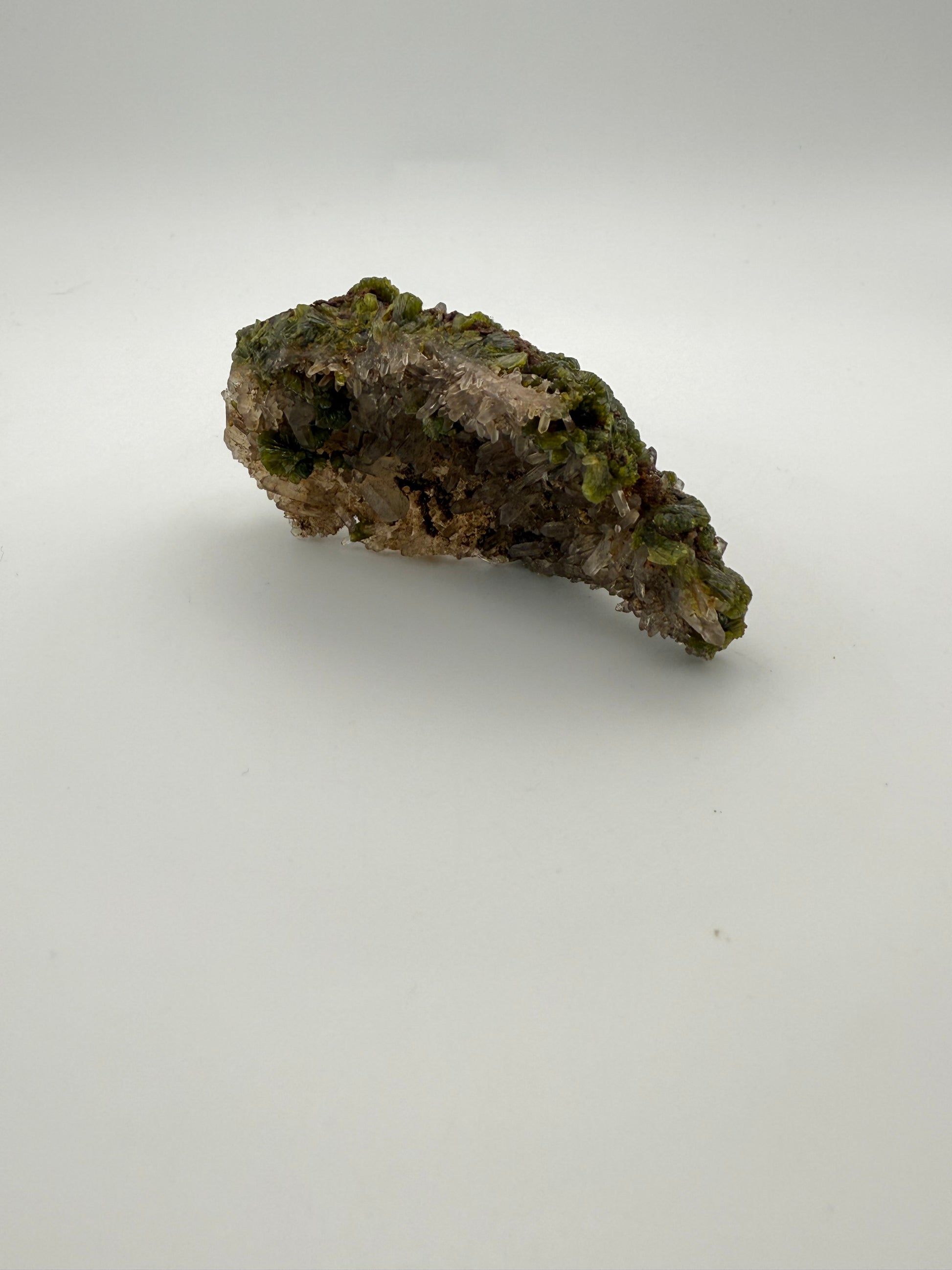 Epidote crystal cluster with good green color as well as quartz.