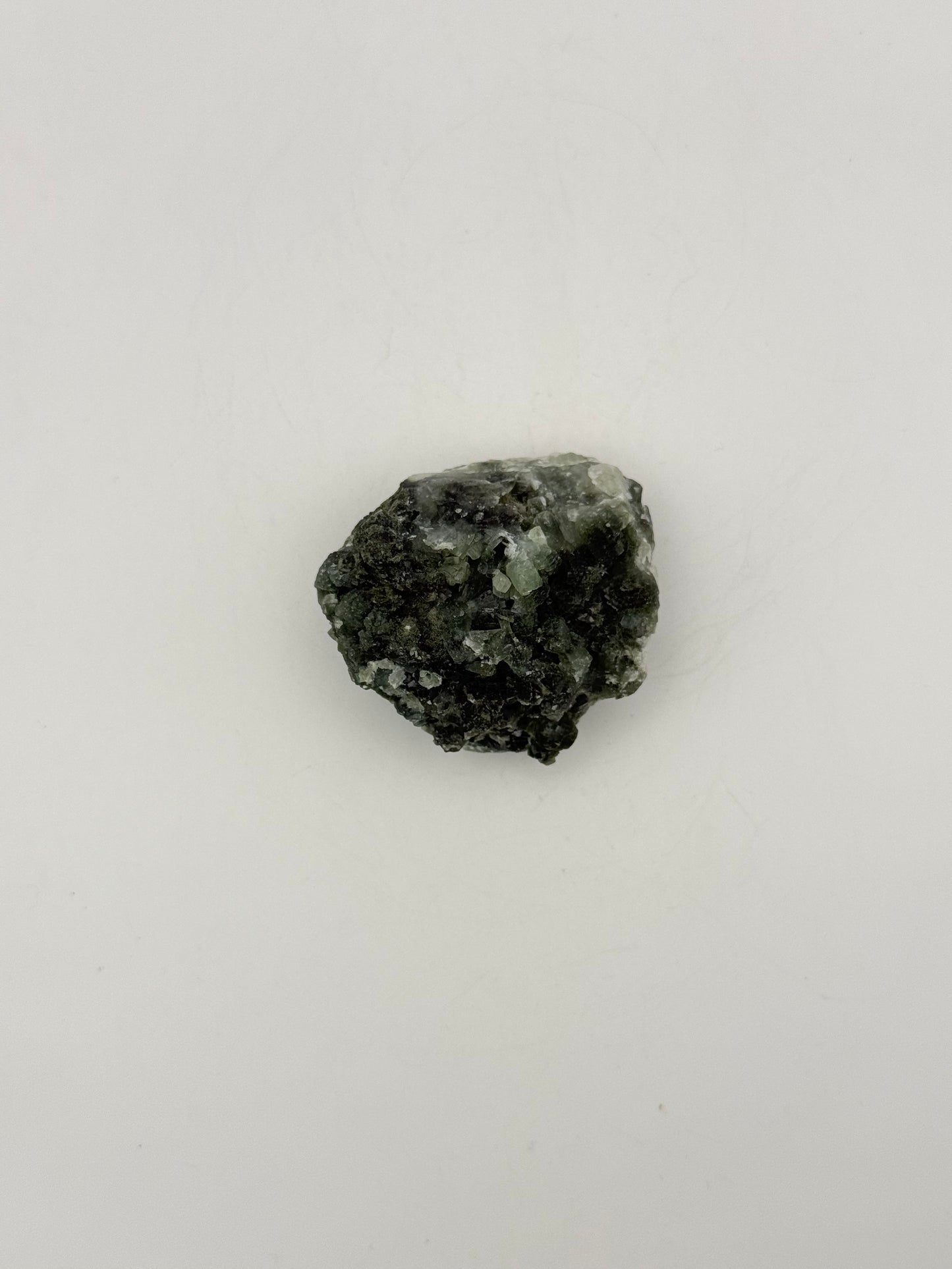 Raw Prehnite specimen with amazing green color.