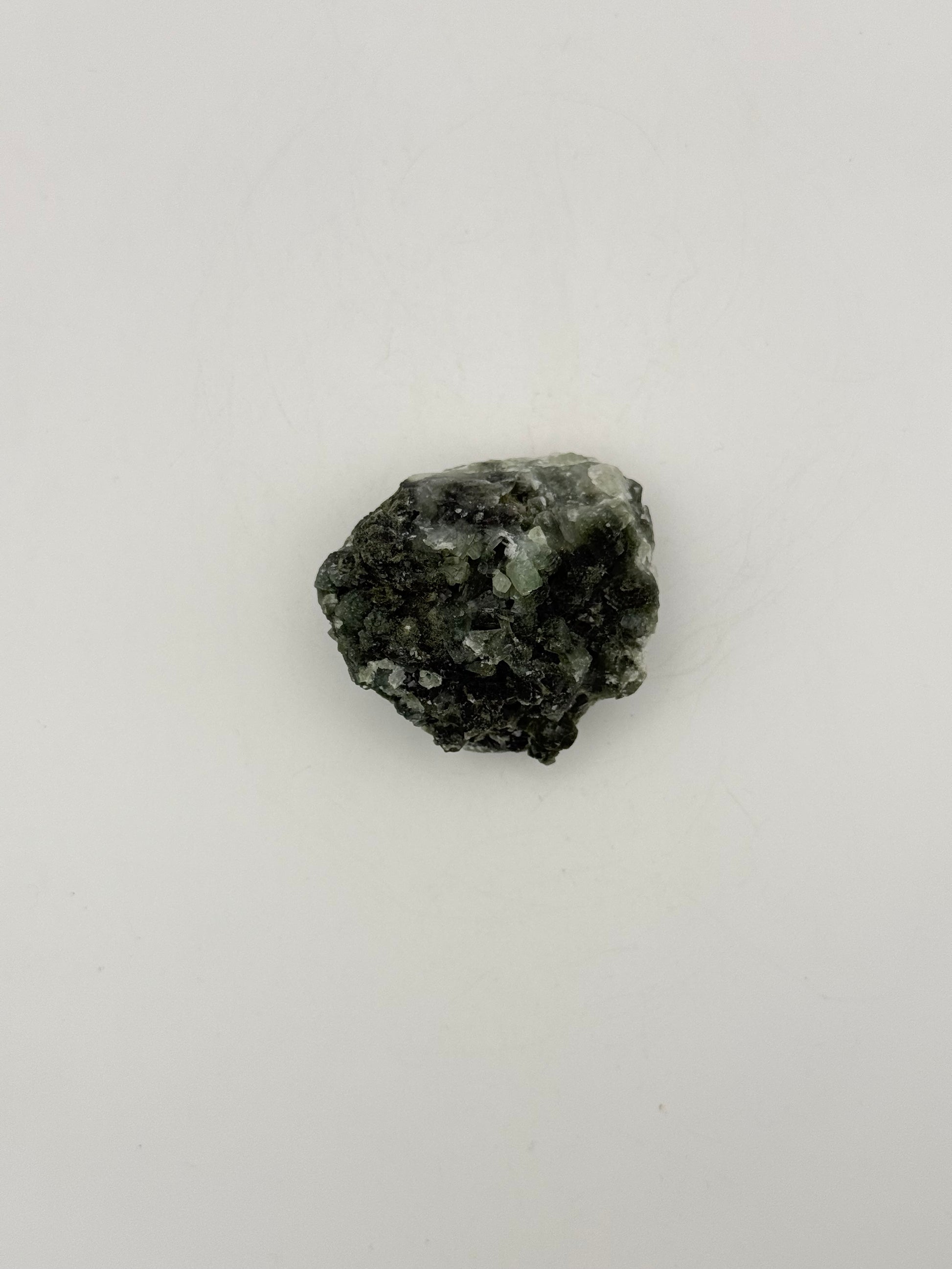 Raw Prehnite specimen with amazing green color.