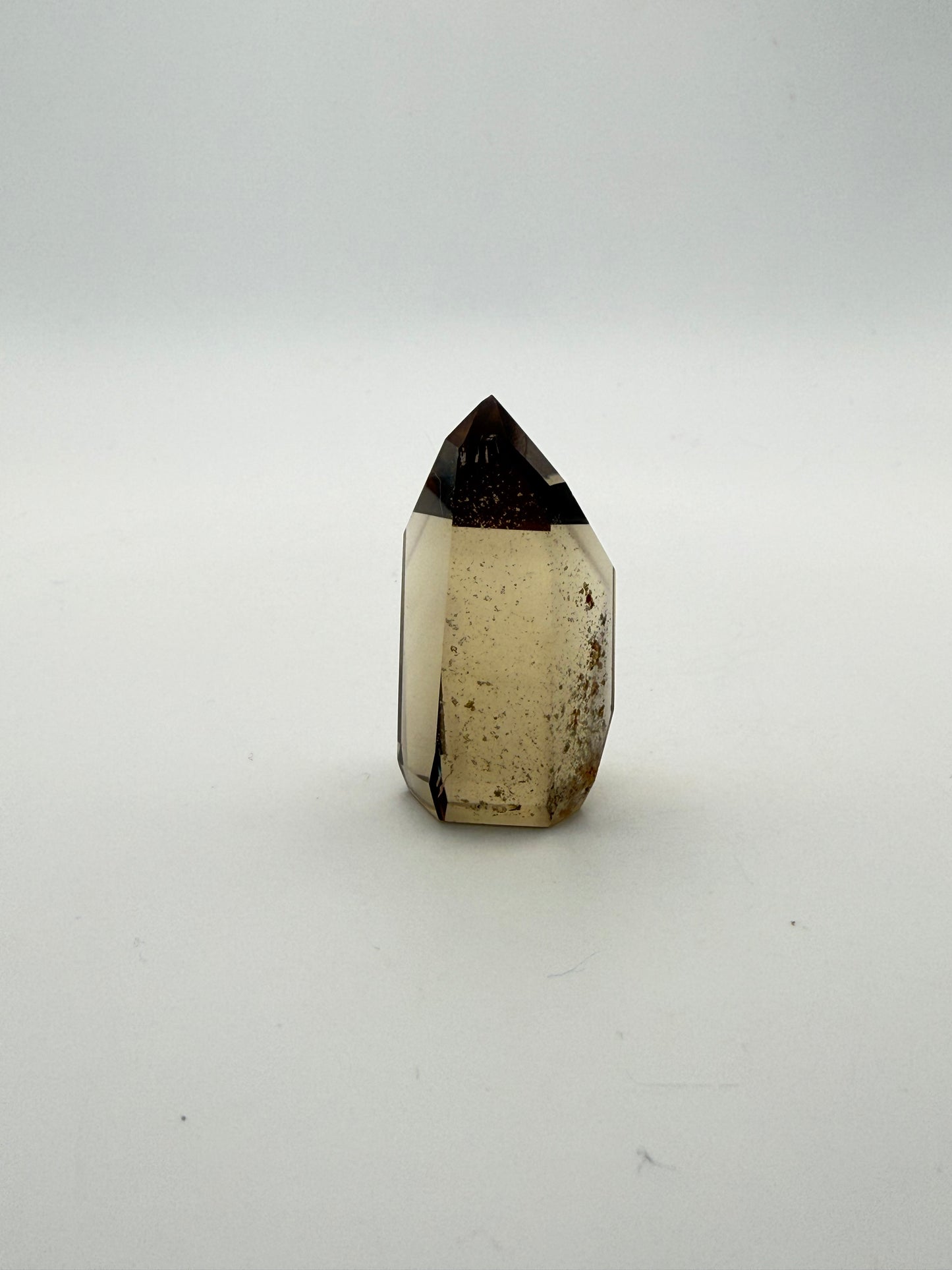 Polished natural citrine point.