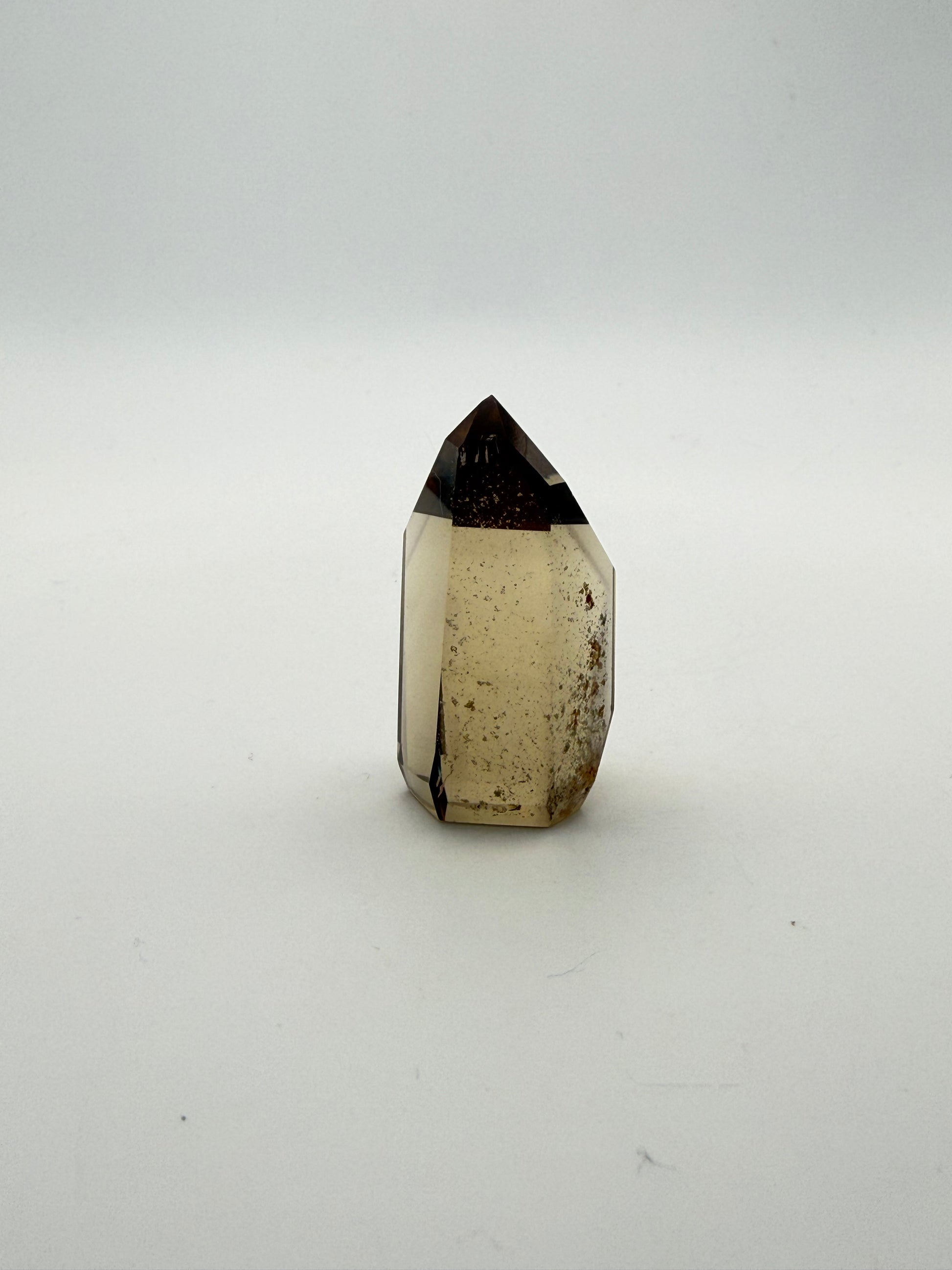 Polished natural citrine point.