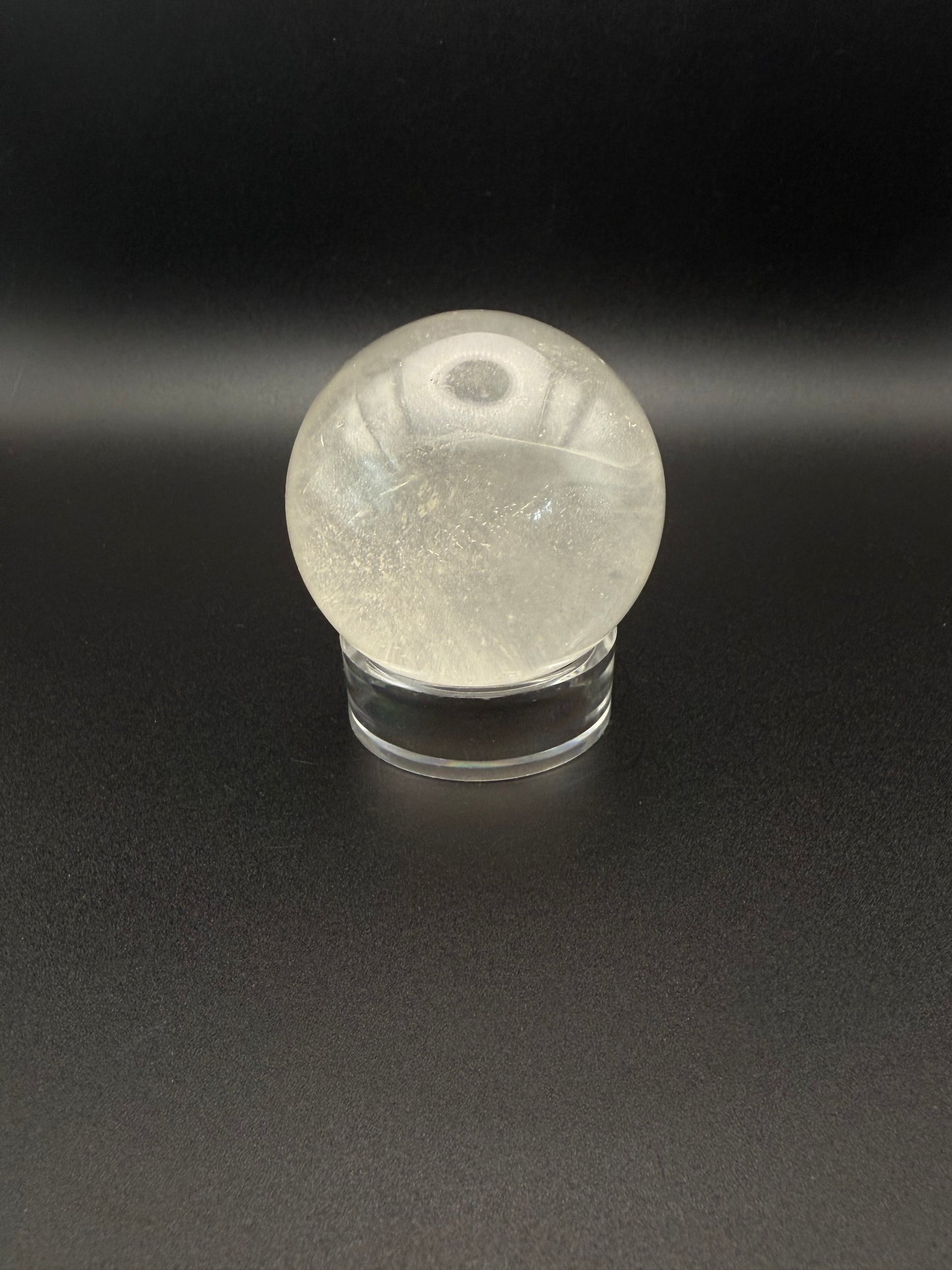 Clear quartz polished crystal sphere.