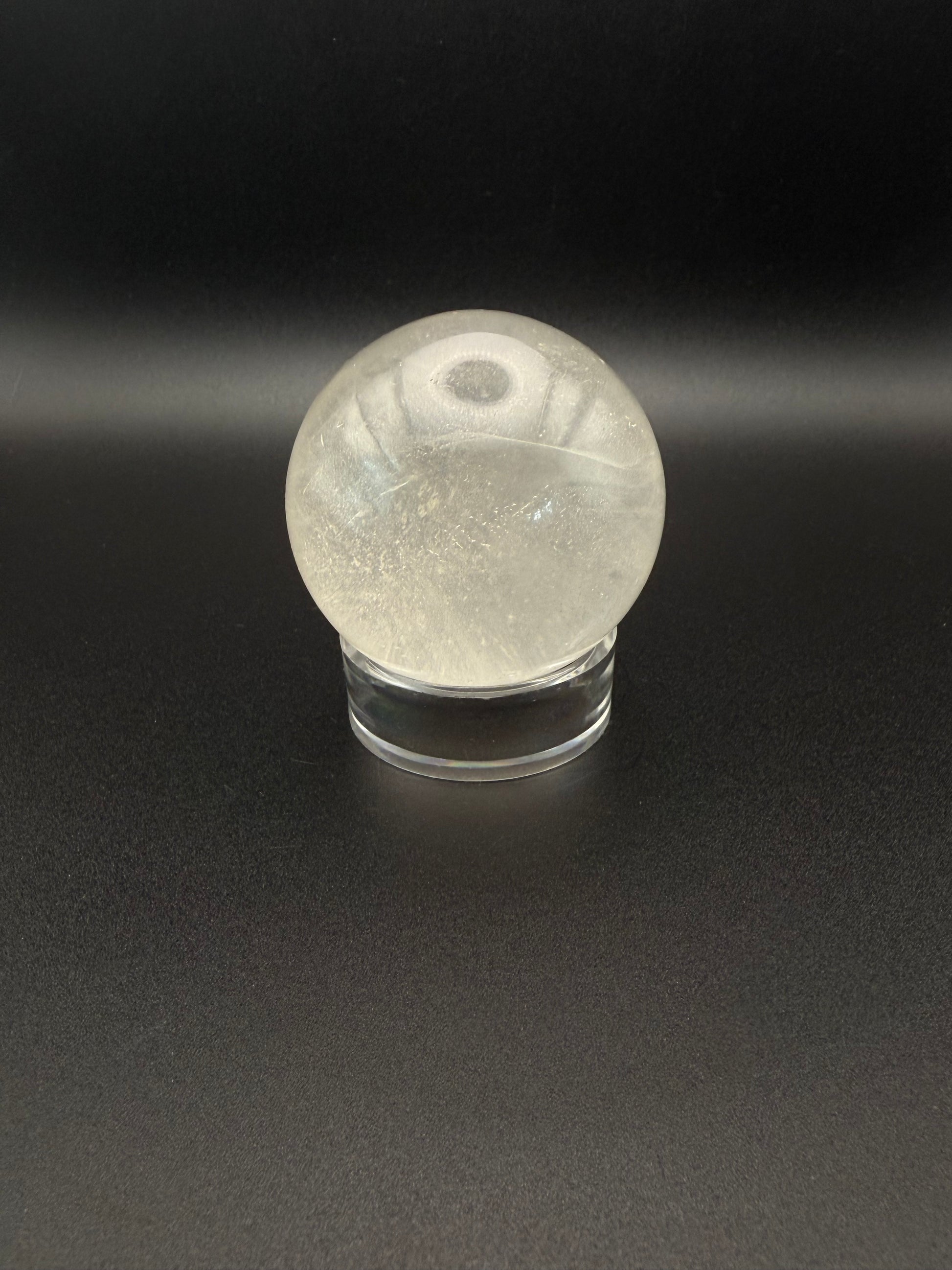 Clear quartz polished crystal sphere.