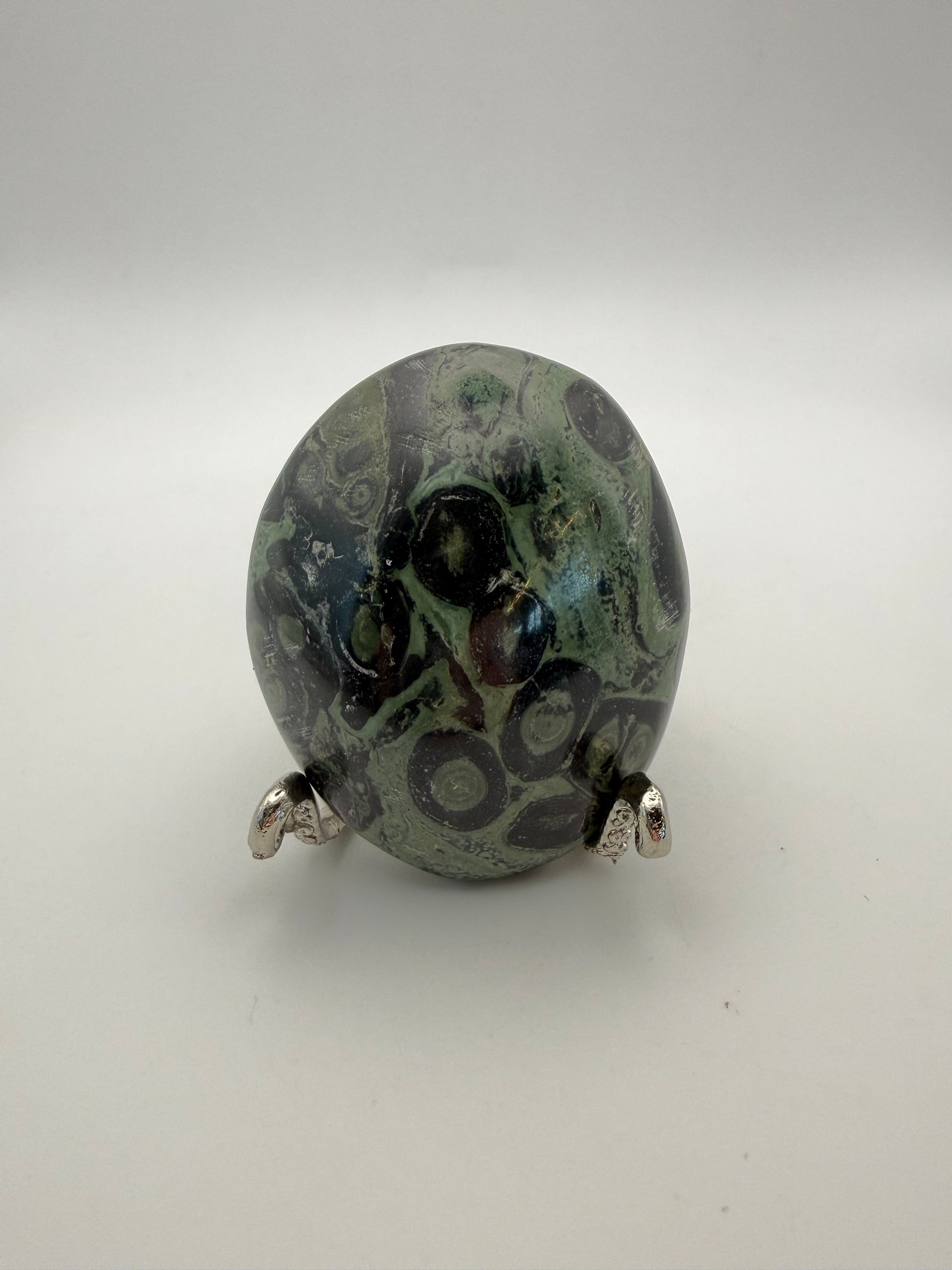 Polished kambaba jasper palm stone.