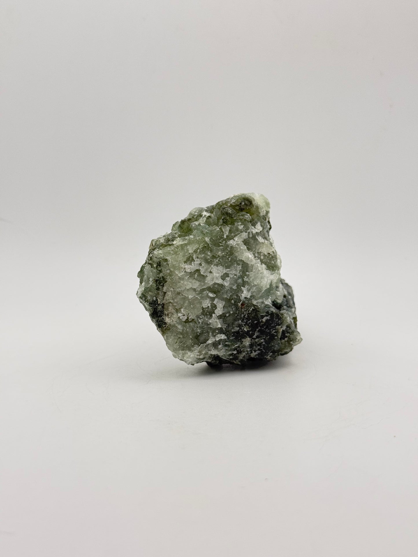 Raw Prehnite specimen with amazing green color.