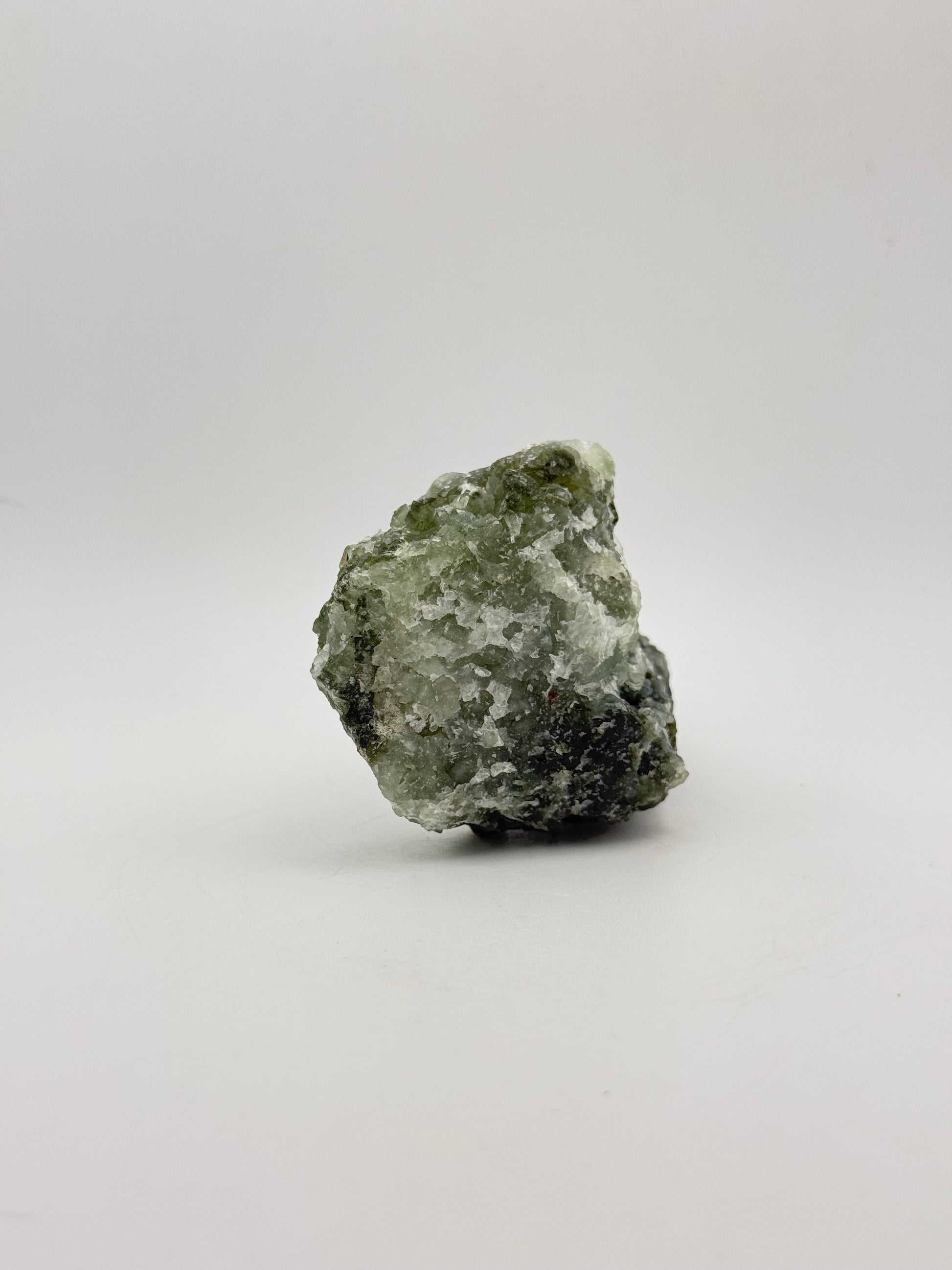 Raw Prehnite specimen with amazing green color.