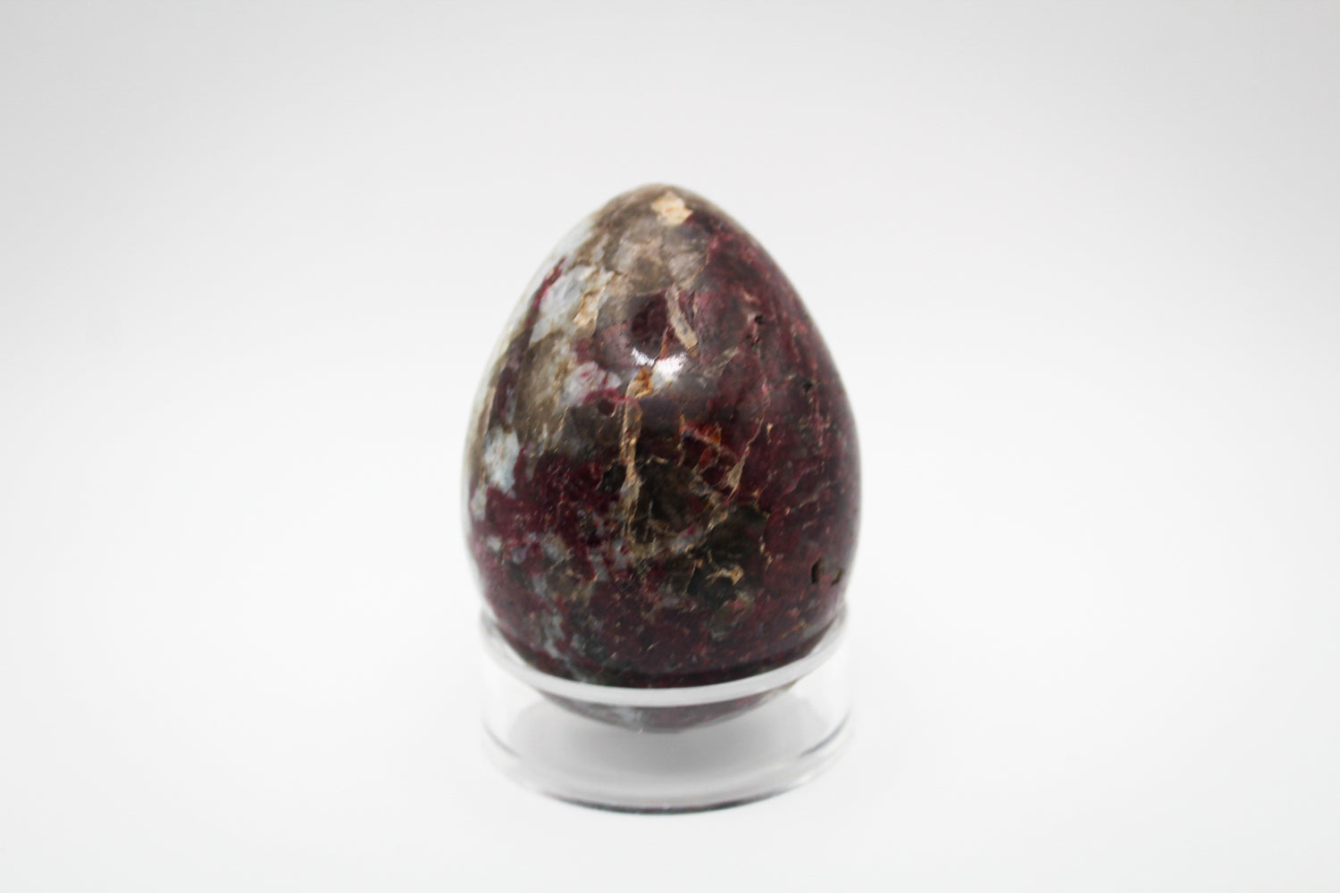 Polished pink tourmaline in the shape of an egg.