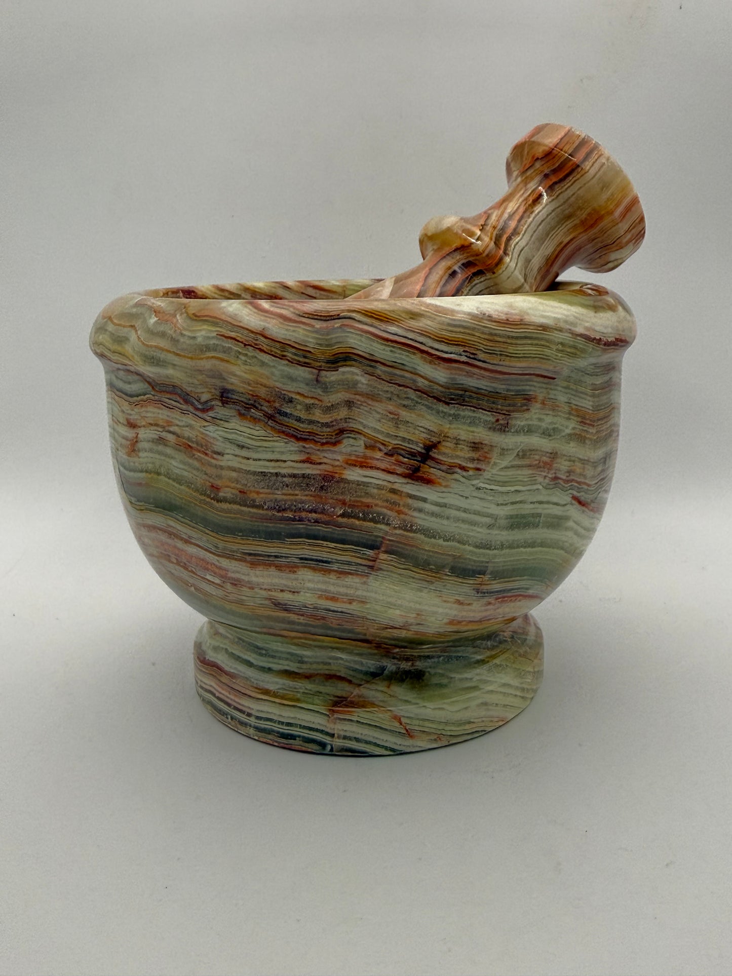 Mortar and pestle made out of onyx stone.