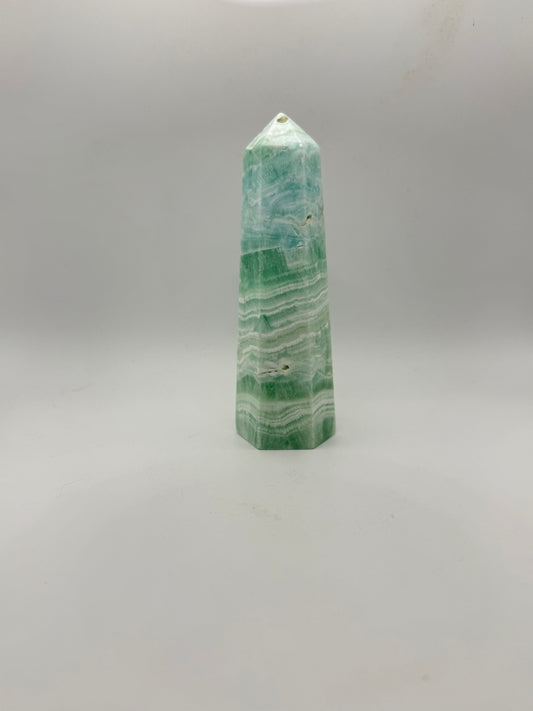 Caribbean Calcite polished six sided tower. This is 5.25 inches tall.