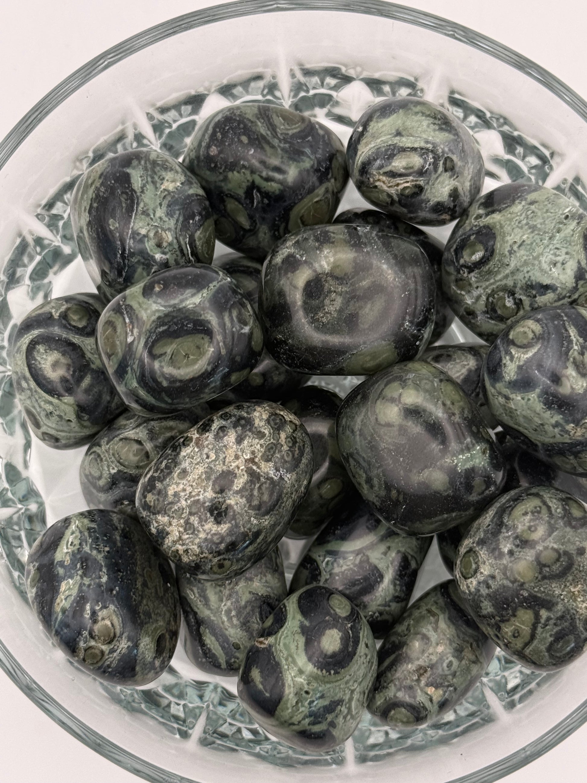 Close-up of polished kambaba jasper tumbles.