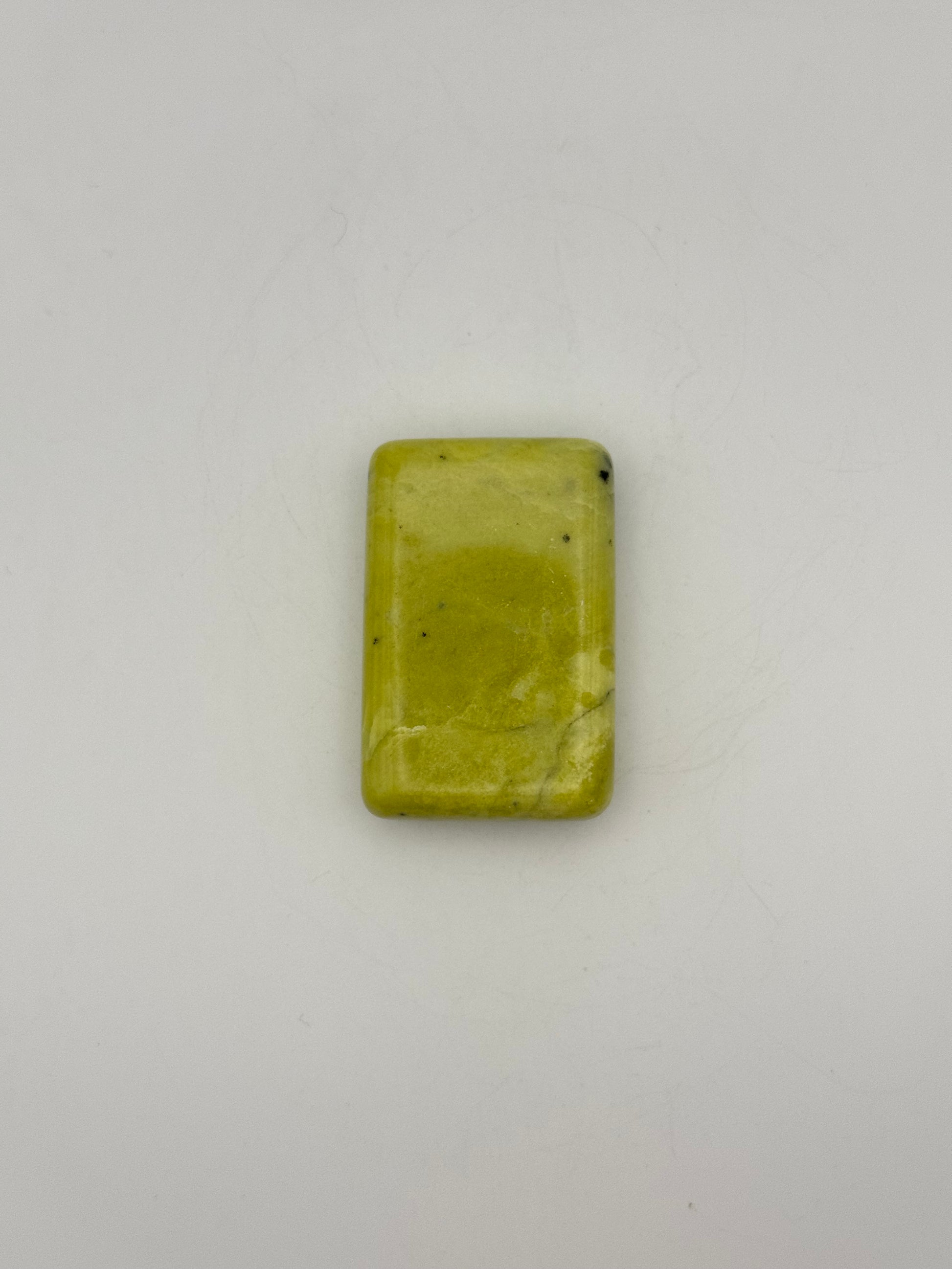Polished healerite in the shape of a rectangular soap.