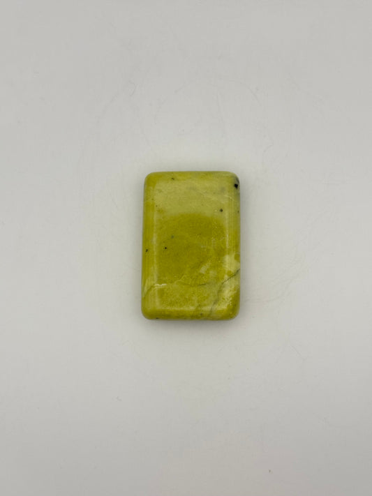 Polished healerite in the shape of a rectangular soap.