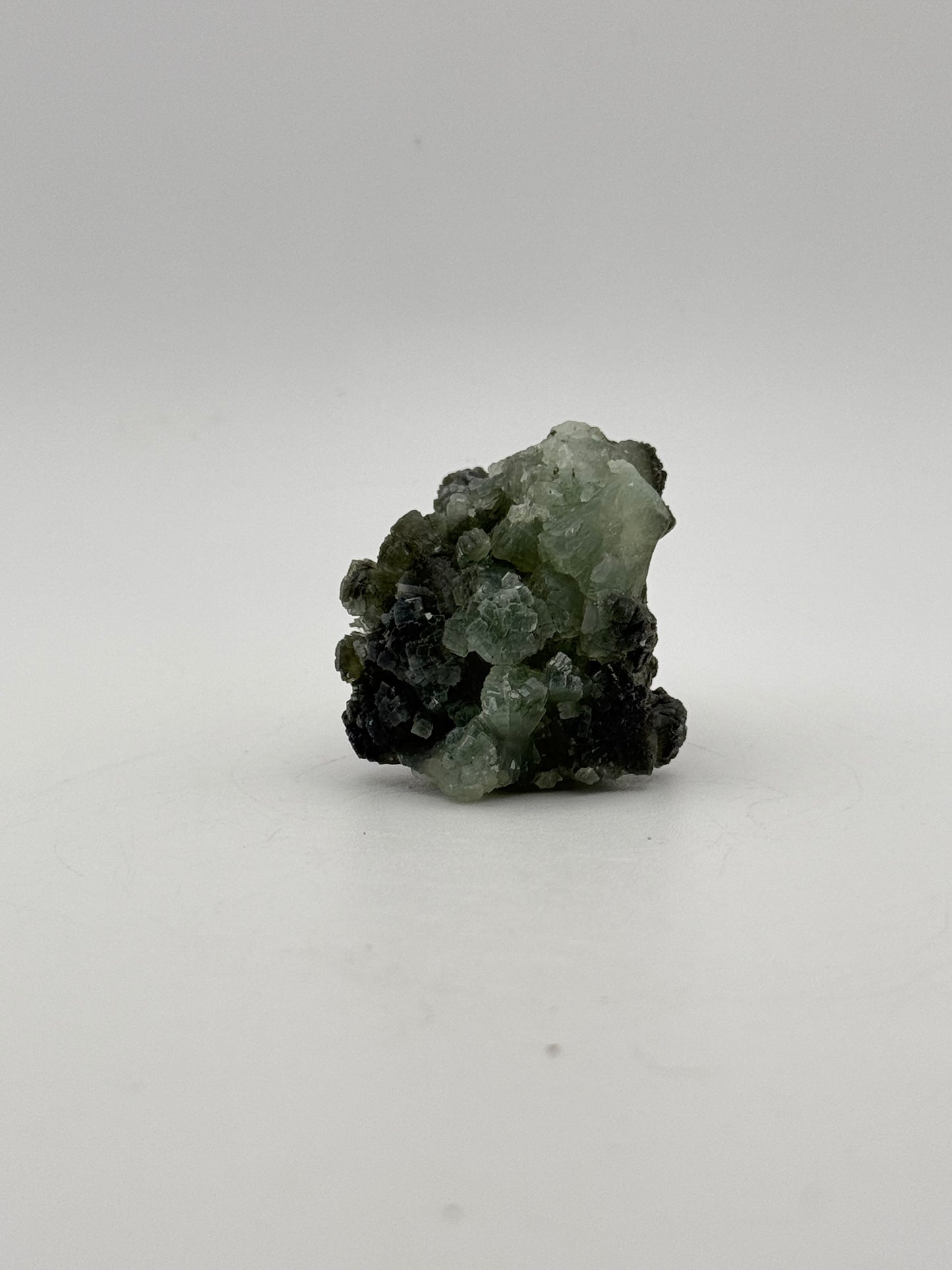 Raw Prehnite specimen with amazing green color.