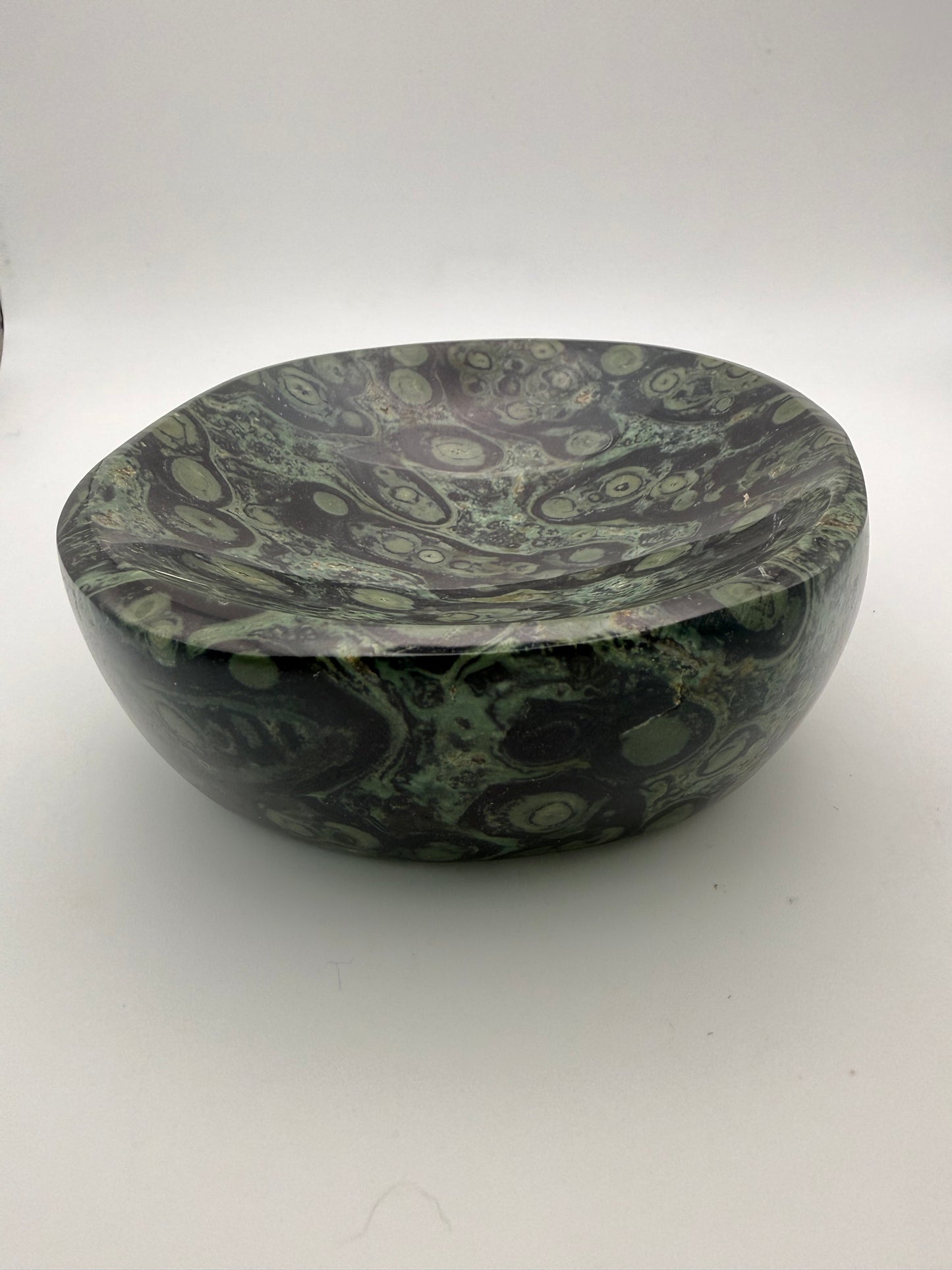 Polished kambaba jasper in the shape of a bowl.