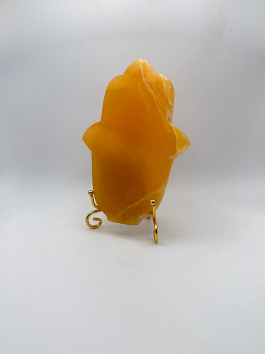 Polished Orange calcite hasma carving.