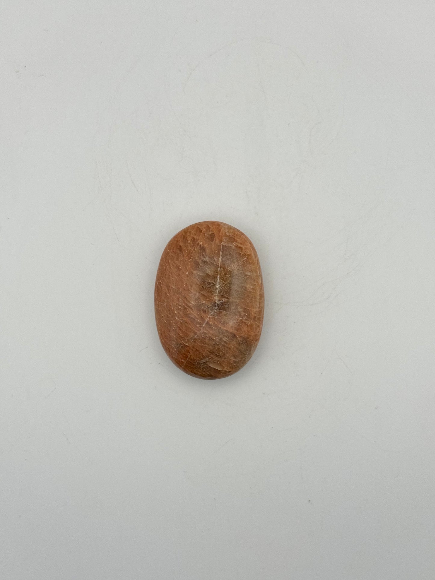 Polished Peach moonstone palm stone.